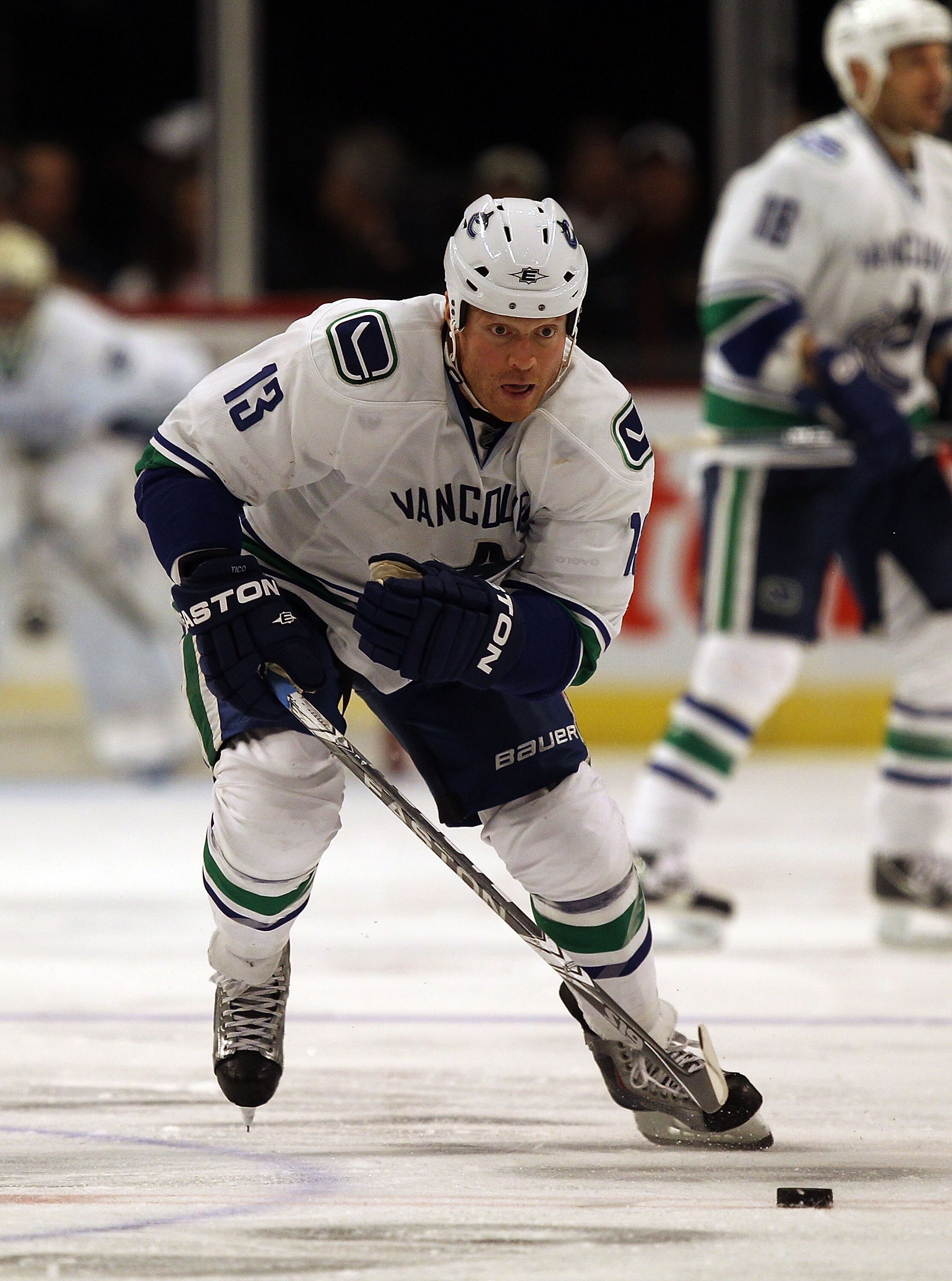 CHICAGO - OCTOBER 20: Raffi Torres #13 of the Vancouver Canucks skates up the ice against the Chicago Blackhawks at the United Center on October 20, 2010 in Chicago, Illinois. The Blackhawks defeated the Canucks 2-1 in overtime. (Photo by Jonathan Daniel/