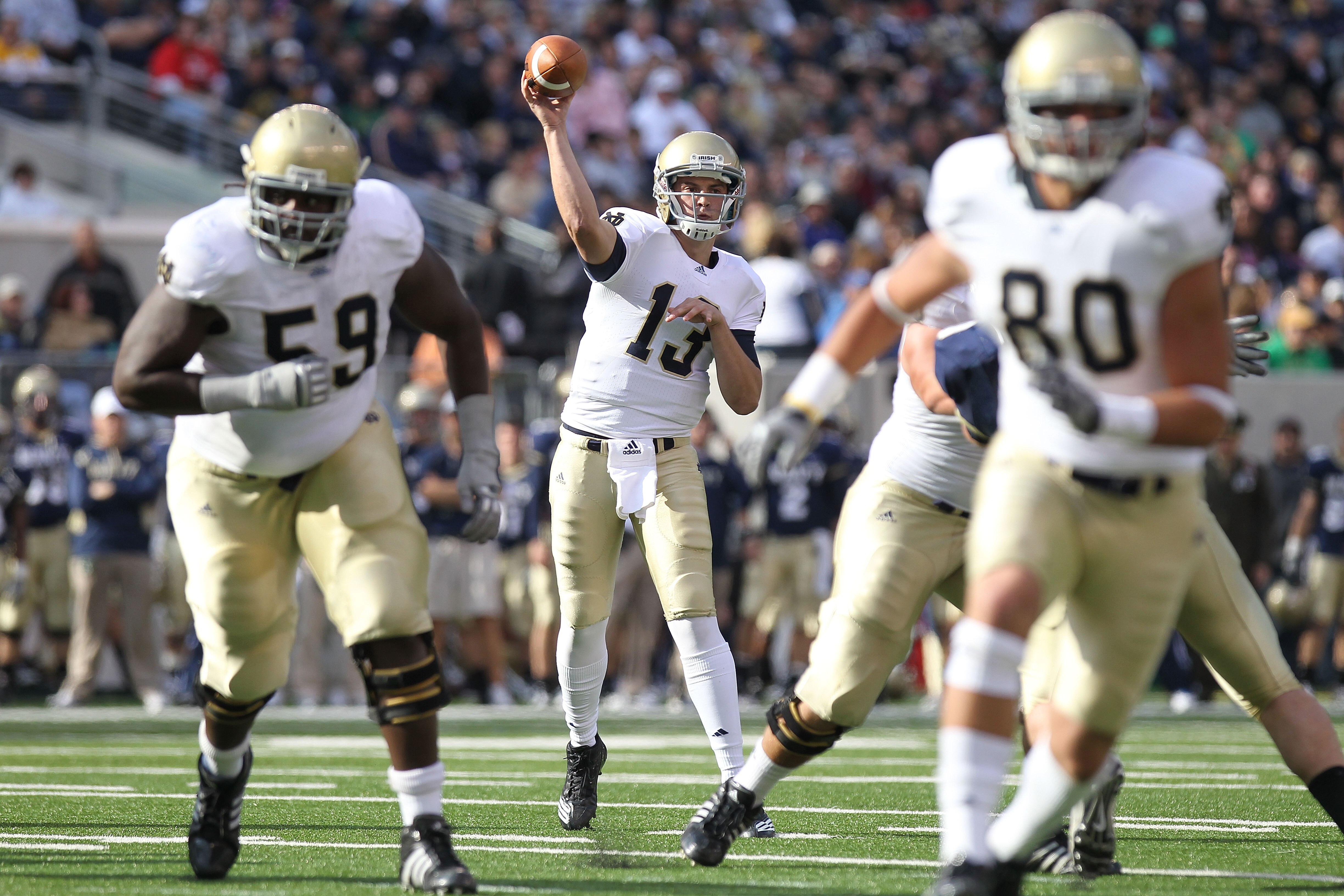 EAST RUTHERFORD, NJ - OCTOBER 23: Tommy Rees #13 of the Notre Dame Fighting Irish passes the ball against the Navy Midshipmen at New Meadowlands Stadium on October 23, 2010 in East Rutherford, New Jersey.  (Photo by Nick Laham/Getty Images)