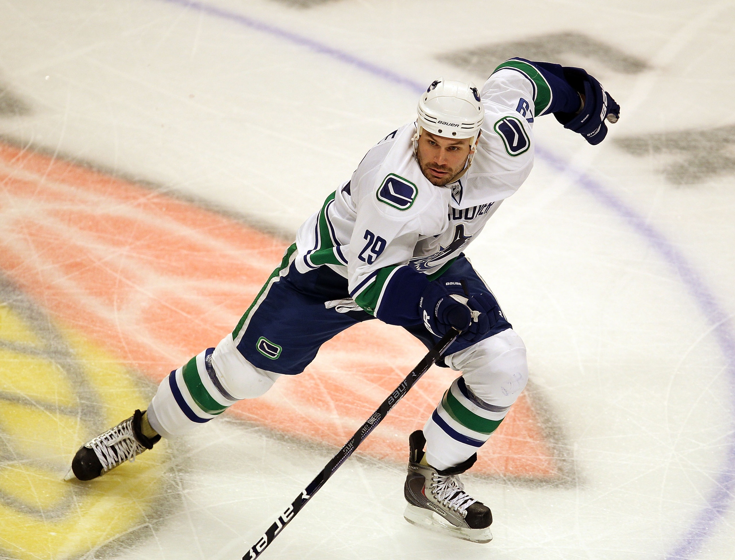 CHICAGO - OCTOBER 20: Aaron Rome #29 of the Vancouver Canucks skates against the Chicago Blackhawks at the United Center on October 20, 2010 in Chicago, Illinois. The Blackhawks defeated the Canucks 2-1 in overtime. (Photo by Jonathan Daniel/Getty Images)