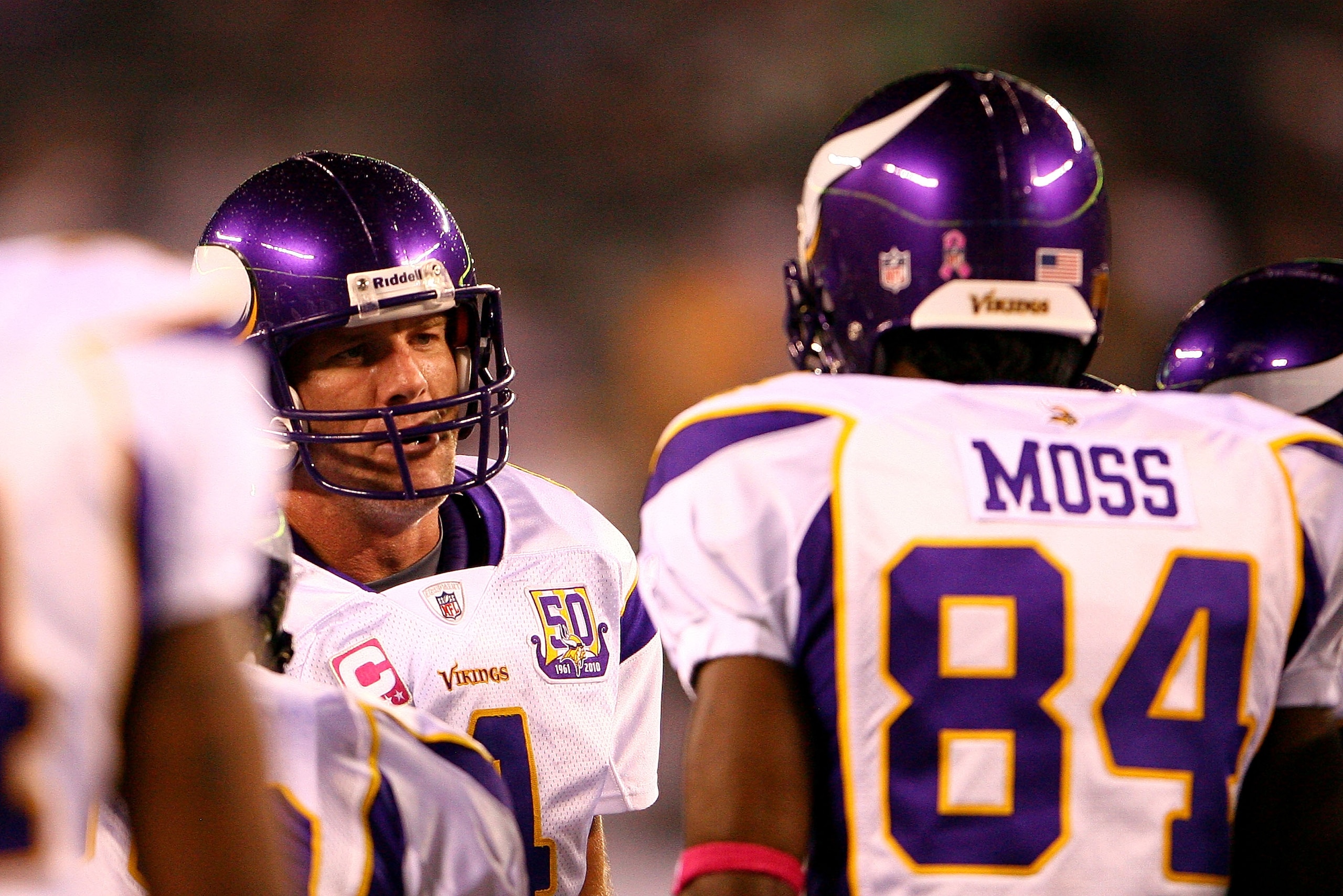 EAST RUTHERFORD, NJ - OCTOBER 11:  Quarterback Brett Favre #4 of the Minnesota Vikings talks with Randy Moss #84 in the huddle during warm ups against the New York Jets at New Meadowlands Stadium on October 11, 2010 in East Rutherford, New Jersey.  (Photo
