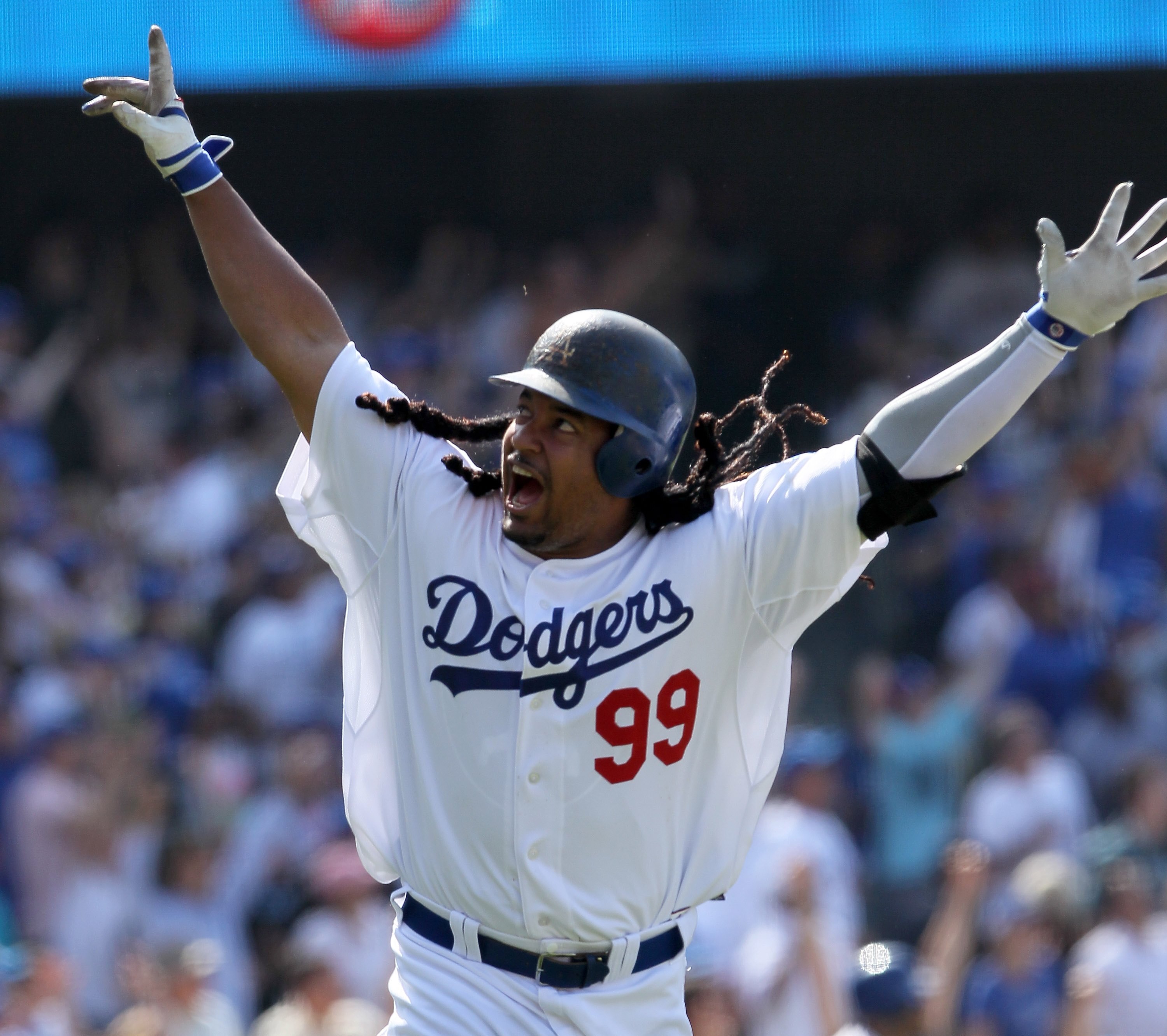 LOS ANGELES, CA - APRIL 18: Manny Ramirez #99 of the Los Angeles Dodgers celebrates after hitting a two-run homerun in the eighth inning against the San Francisco Giants at Dodger Stadium on April 18, 2010 in Los Angeles, California. The Dodgers defeated LOS ANGELES, CA - APRIL 18: Manny Ramirez #99 of the Los Angeles Dodgers celebrates after hitting a two-run homerun in the eighth inning against the San Francisco Giants at Dodger Stadium on April 18, 2010 in Los Angeles, California. The Dodgers defeated