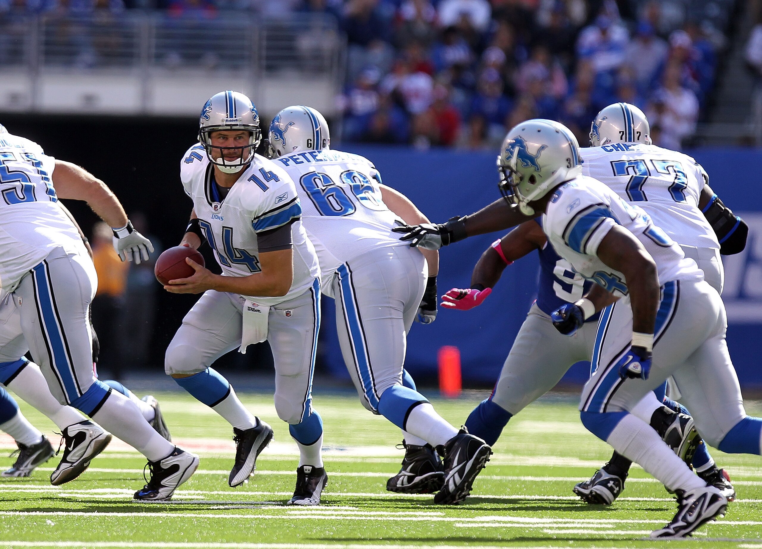 EAST RUTHERFORD, NJ - OCTOBER 17:  Shaun Hill #14 of the Detroit Lions rushes against the New York Giants at New Meadowlands Stadium on October 17, 2010 in East Rutherford, New Jersey.  (Photo by Nick Laham/Getty Images)