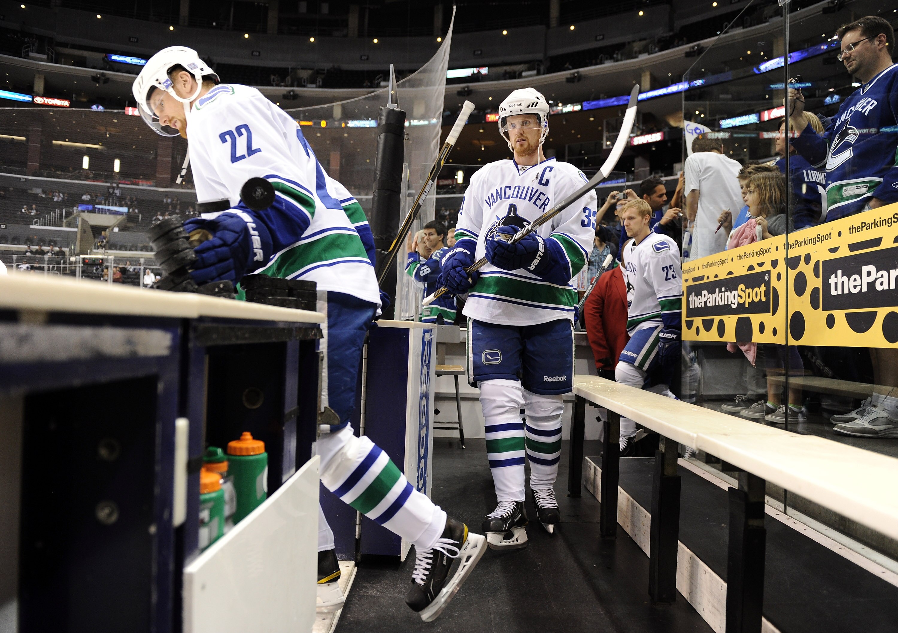 LOS ANGELES, CA - OCTOBER 15:  Henrik Sedin #33 and Daniel Sedin #22 of the Vancouver Canucks step on to the ice for warm up against the Los Angeles Kings at the Staples Center on October 15, 2010 in Los Angeles, California.  (Photo by Harry How/Getty Ima