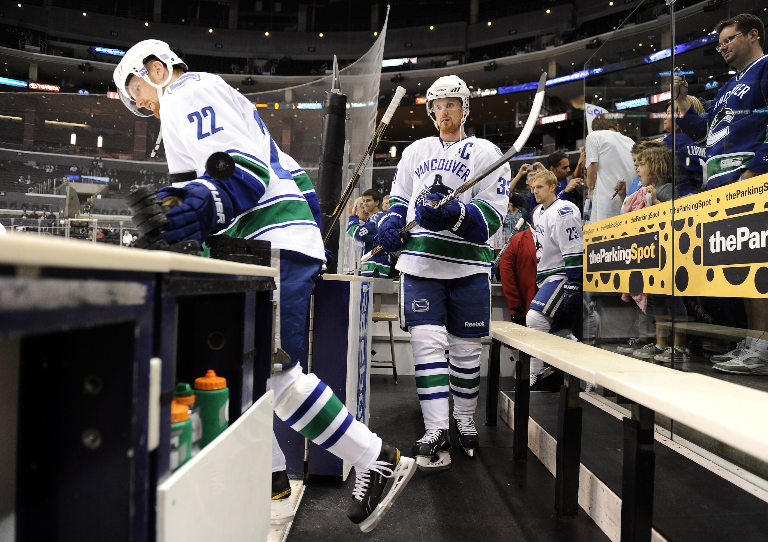 LOS ANGELES, CA - OCTOBER 15:  Henrik Sedin #33 and Daniel Sedin #22 of the Vancouver Canucks step on to the ice for warm up against the Los Angeles Kings at the Staples Center on October 15, 2010 in Los Angeles, California.  (Photo by Harry How/Getty Ima