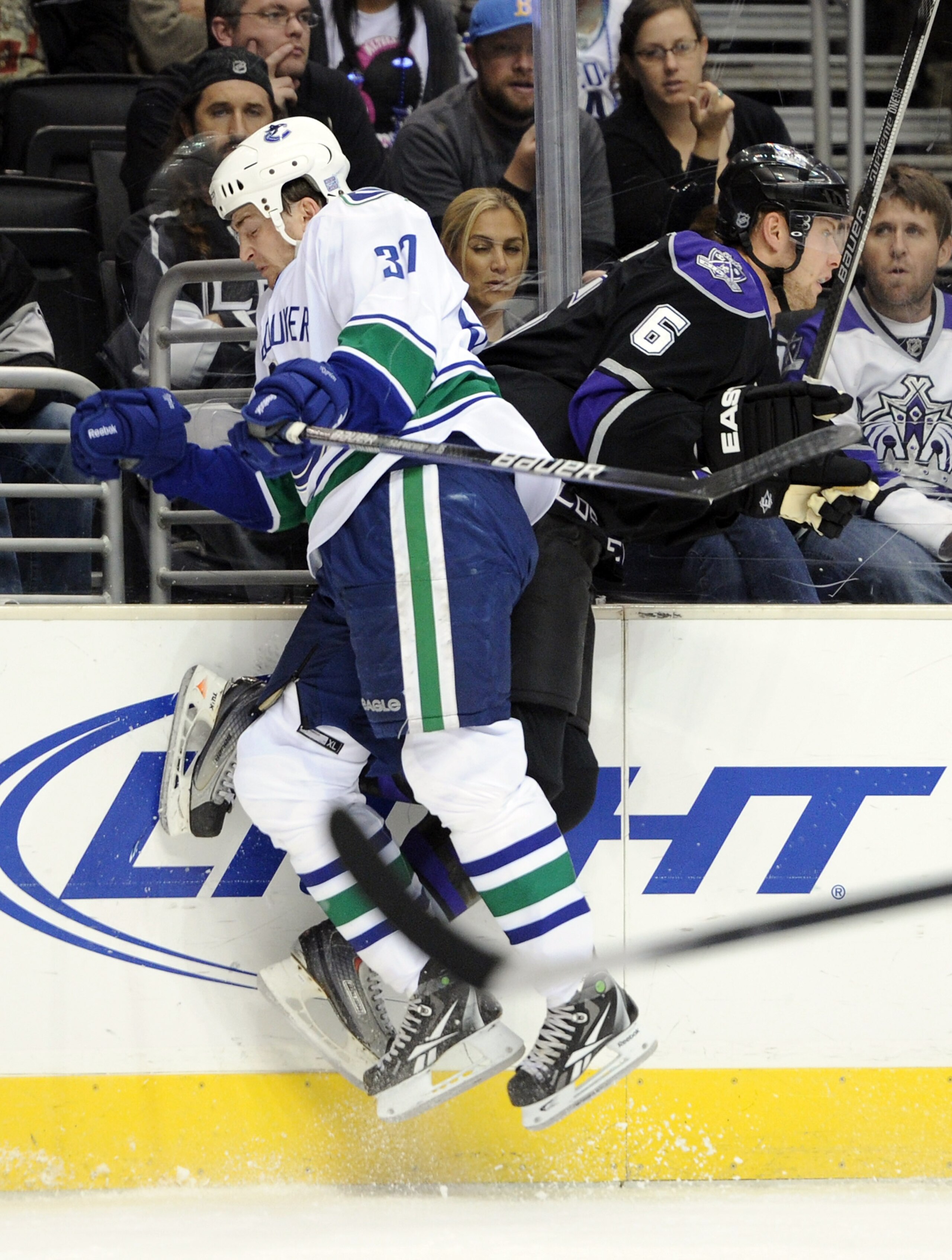 LOS ANGELES, CA - OCTOBER 15:  Rick Rypien #37 of the Vancouver Canucks collides with Jake Muzzin #6 of the Los Angeles Kings during the first period at the Staples Center on October 15, 2010 in Los Angeles, California.  (Photo by Harry How/Getty Images)
