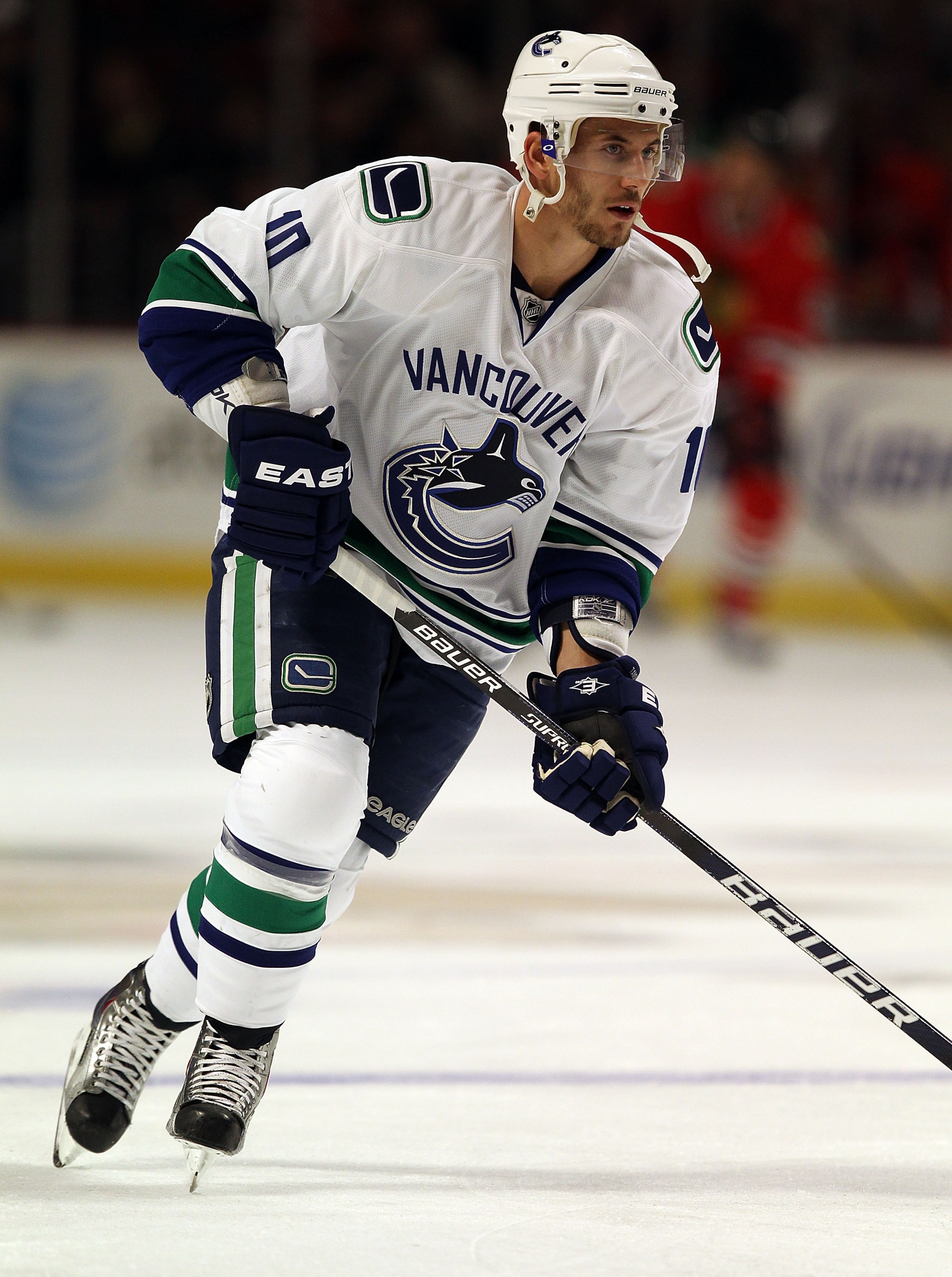 CHICAGO - OCTOBER 20: Jeff Tambellini #10 of the Vancouver Canucks participates in warm-ups before a game against the Chicago Blackhawks at the United Center on October 20, 2010 in Chicago, Illinois. The Blackhawks defeated the Canucks 2-1 in overtime.  (