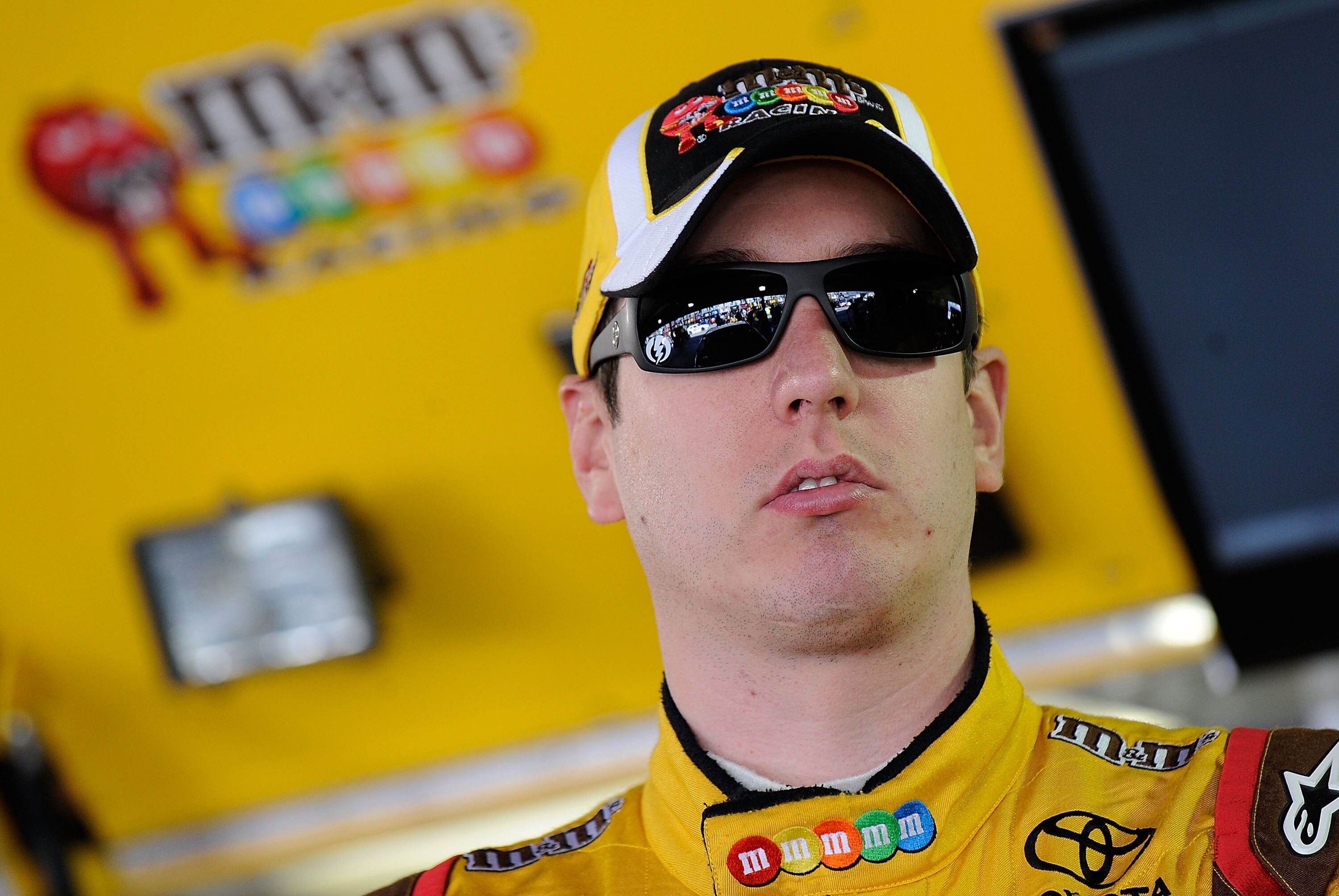 MARTINSVILLE, VA - OCTOBER 22: Kyle Busch, driver of the #18 M&M's Toyota, stands in the garage prior to practice for the NASCAR Sprint Cup Series TUMS Fast Relief 500 at Martinsville Speedway on October 22, 2010 in Martinsville, Virginia. (Photo by Rus MARTINSVILLE, VA - OCTOBER 22: Kyle Busch, driver of the #18 M&M's Toyota, stands in the garage prior to practice for the NASCAR Sprint Cup Series TUMS Fast Relief 500 at Martinsville Speedway on October 22, 2010 in Martinsville, Virginia. (Photo by Rus
