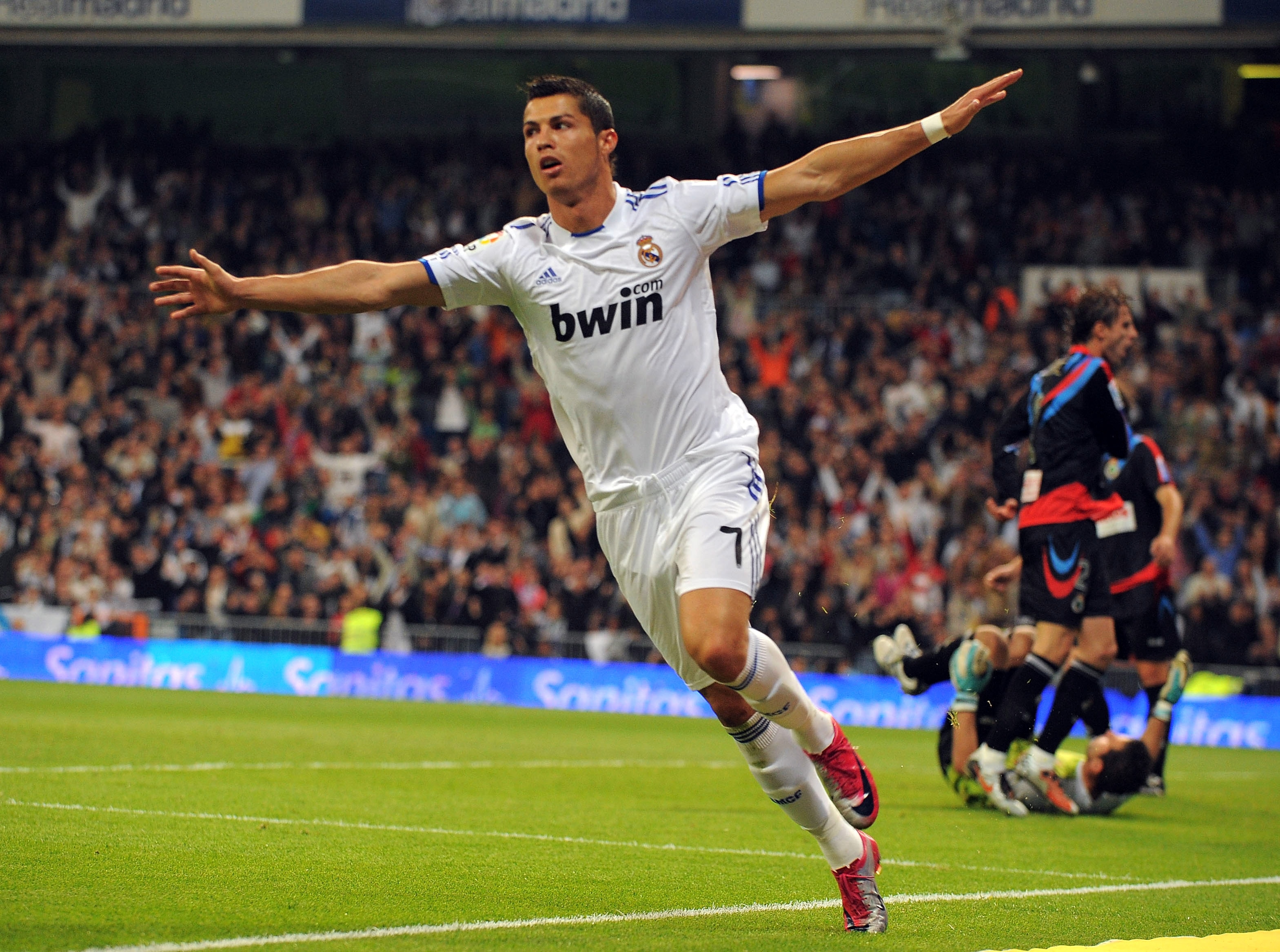 MADRID, SPAIN - OCTOBER 23: Cristiano Ronaldo of Real Madrid celebrates after scoring Real's second goal during the La Liga match between Real Madrid and Racing Santander at Estadio Santiago Bernabeu on October 23, 2010 in Madrid, Spain. (Photo by Denis MADRID, SPAIN - OCTOBER 23: Cristiano Ronaldo of Real Madrid celebrates after scoring Real's second goal during the La Liga match between Real Madrid and Racing Santander at Estadio Santiago Bernabeu on October 23, 2010 in Madrid, Spain. (Photo by Denis