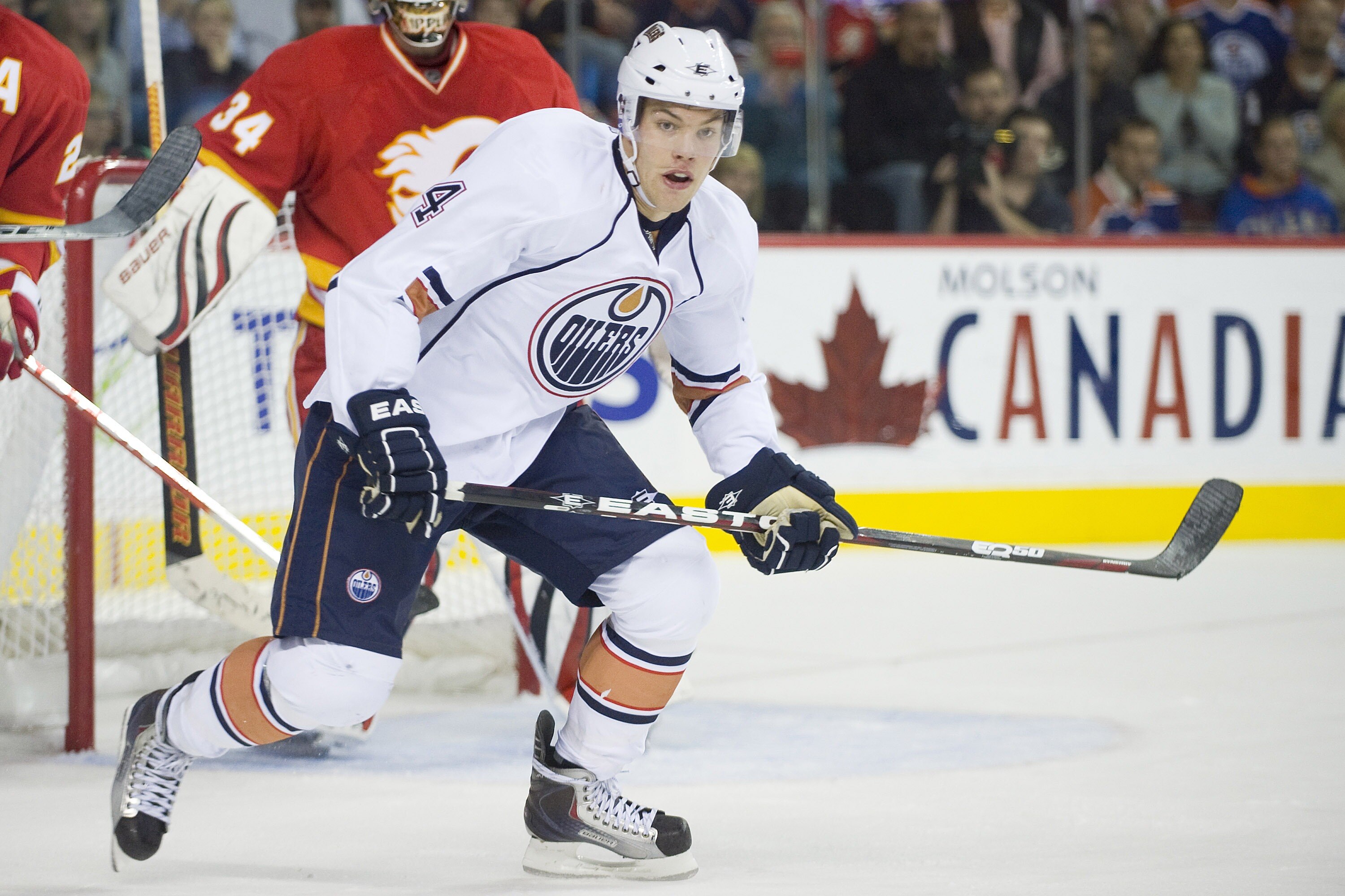 EDMONTON, CANADA - OCTOBER 16:  Edmonton Oilers left wing Taylor Hall #4 follows the play during a game against the Calgary Flames at the Scotiabank Saddledome  on October 16, 2010 in Calgary, Alberta, Canada.  The Flames beat the Oilers 5-3.  (Photo by D