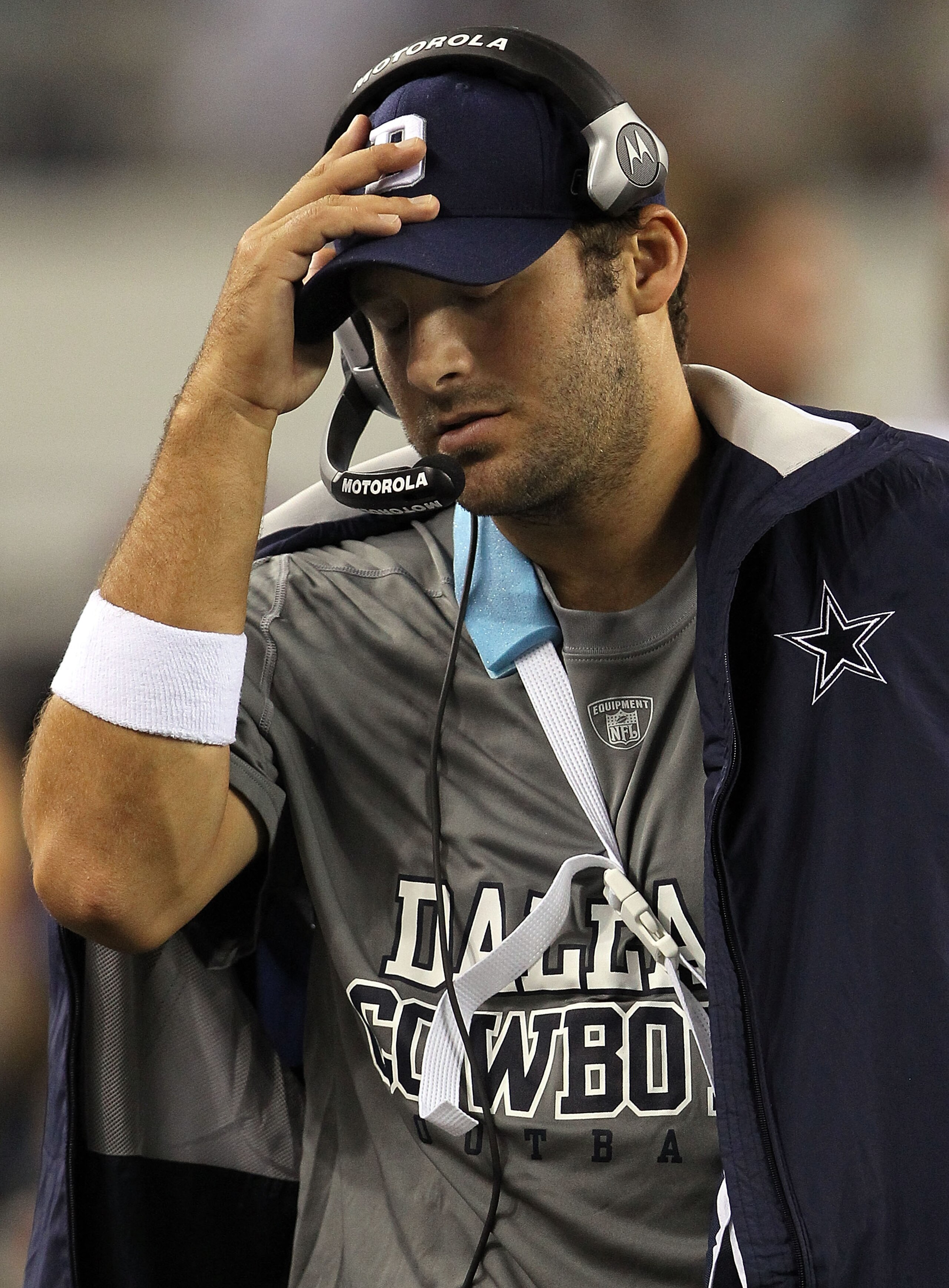 ARLINGTON, TX - OCTOBER 25:  Quarterback Tony Romo #9 of the Dallas Cowboys wears a sling on the sidelines after a left shoulder injury against the New York Giants at Cowboys Stadium on October 25, 2010 in Arlington, Texas.  (Photo by Ronald Martinez/Gett