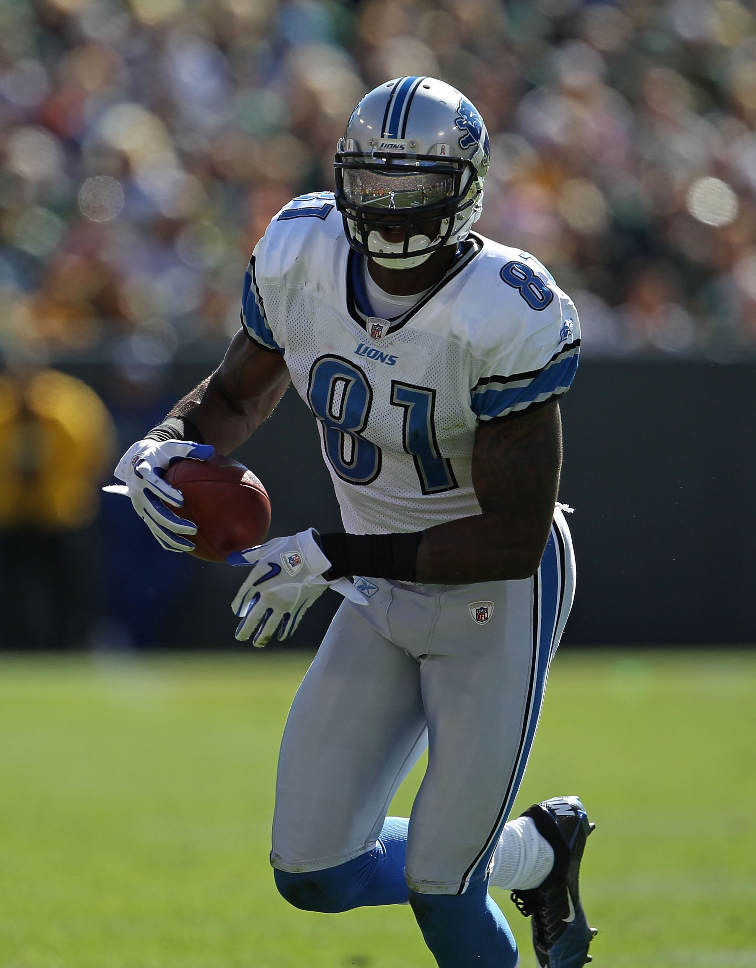 GREEN BAY, WI - OCTOBER 03: Calvin Johnson #81 of the Detroit Lions runs toward the end zone against the Green Bay Packers at Lambeau Field on October 3, 2010 in Green Bay, Wisconsin. The Packers defeated the Lions 28-26. (Photo by Jonathan Daniel/Getty I GREEN BAY, WI - OCTOBER 03: Calvin Johnson #81 of the Detroit Lions runs toward the end zone against the Green Bay Packers at Lambeau Field on October 3, 2010 in Green Bay, Wisconsin. The Packers defeated the Lions 28-26. (Photo by Jonathan Daniel/Getty I