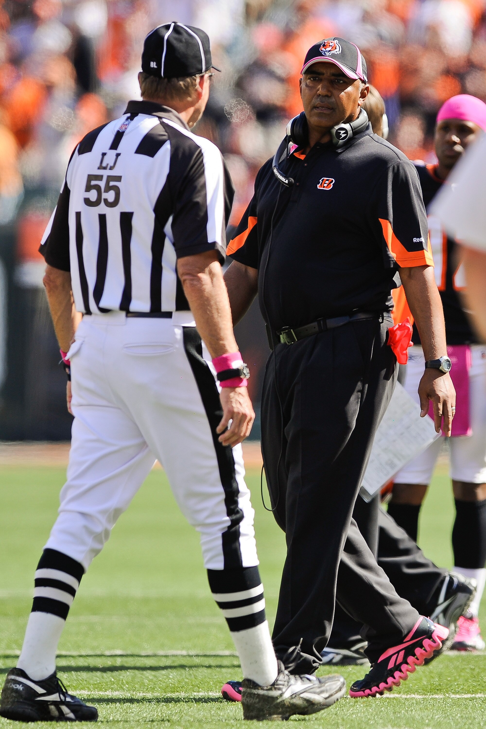 CINCINNATI, OH - OCTOBER 10: Head Coach Marvin Lewis of the Cincinnati Bengals talks with Line Judge Tom Barnes #55 during a game against the Tampa Bay Buccaneers at Paul Brown Stadium on October 10, 2010 in Cincinnati, Ohio. (Photo by Jamie Sabau/Getty I
