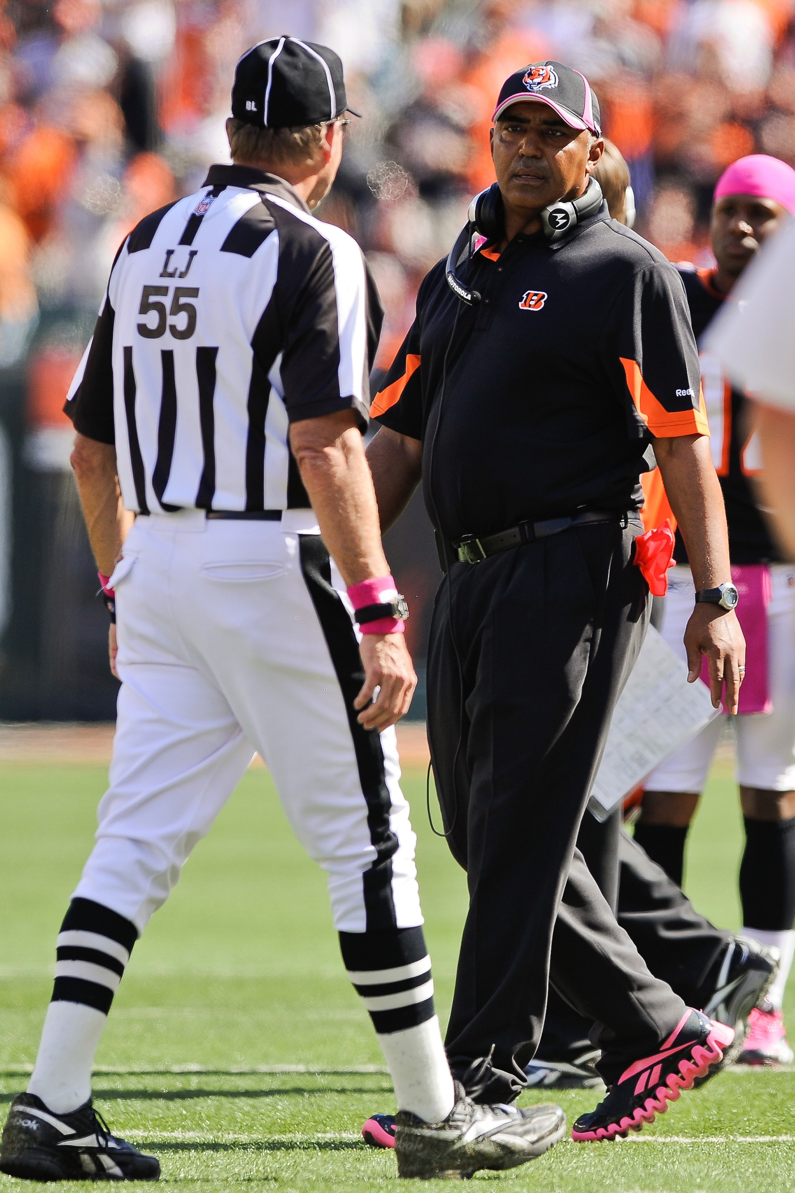 CINCINNATI, OH - OCTOBER 10: Head Coach Marvin Lewis of the Cincinnati Bengals talks with Line Judge Tom Barnes #55 during a game against the Tampa Bay Buccaneers at Paul Brown Stadium on October 10, 2010 in Cincinnati, Ohio. (Photo by Jamie Sabau/Getty I