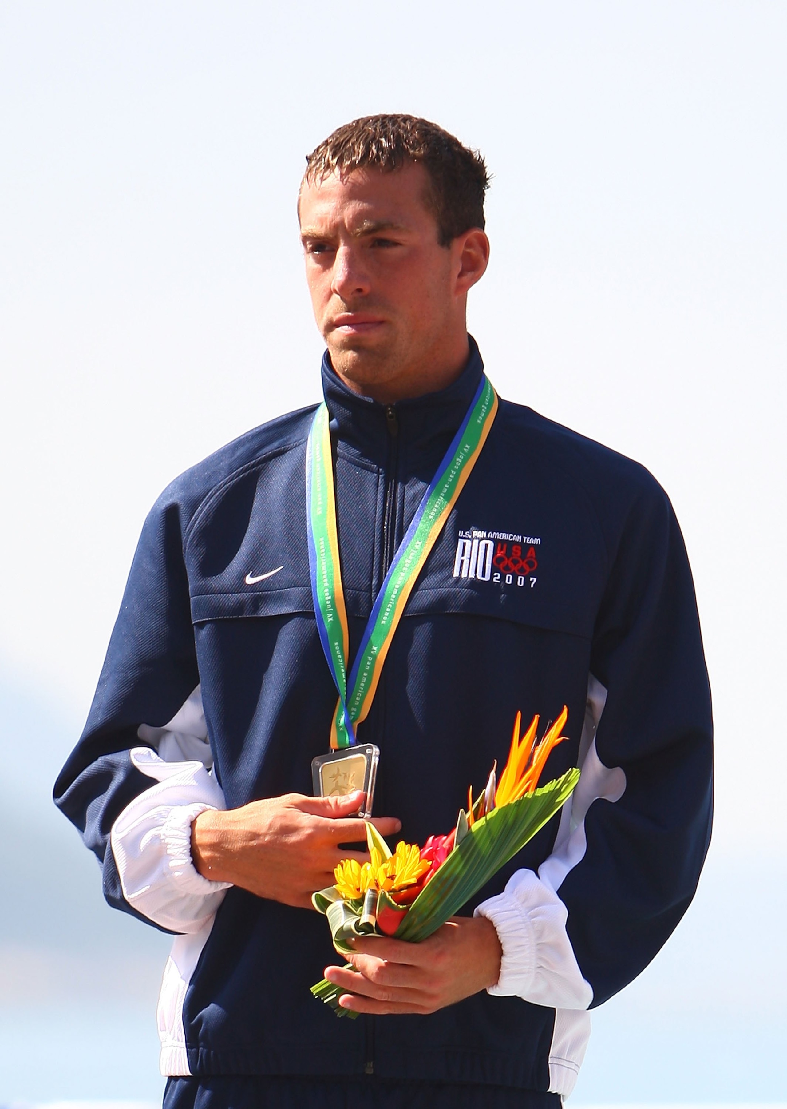 RIO DE JANEIRO, BRAZIL - JULY 14:  Fran Crippen of the United States of America stands on the podium after winning the gold medal in the Men's Swimming Marathon 10km Final, part of the 2007 XV Pan American Games on July 14, 2007 at Copacabana Beach in Rio