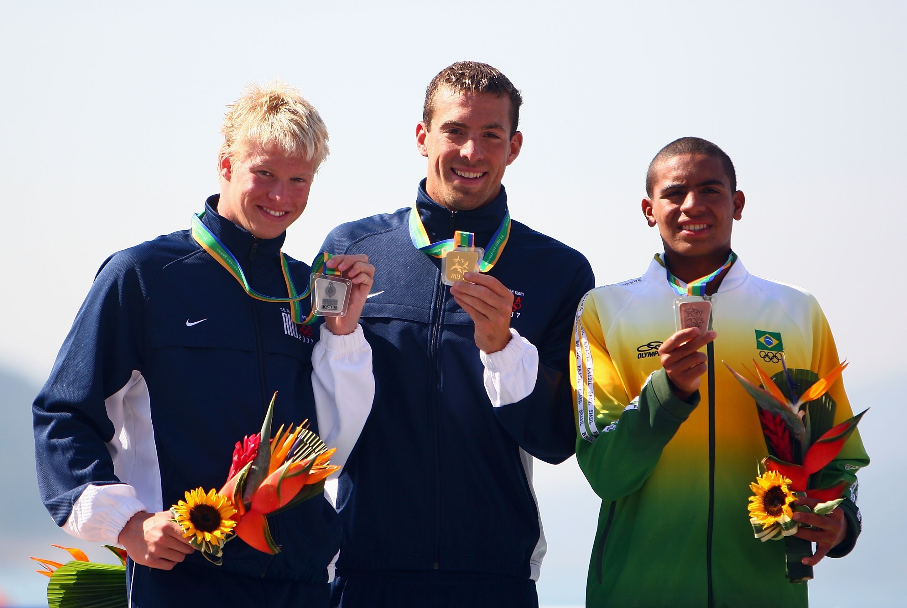 RIO DE JANEIRO, BRAZIL - JULY 14:  (L-R) Charles Peterson of the USA with Silver, Fran Crippen of the USA with Gold and Allan Carmo of Brazil with Bronze on the podium during the Men's Swimming Marathon 10km Final, part of the XV Pan American Games on Jul