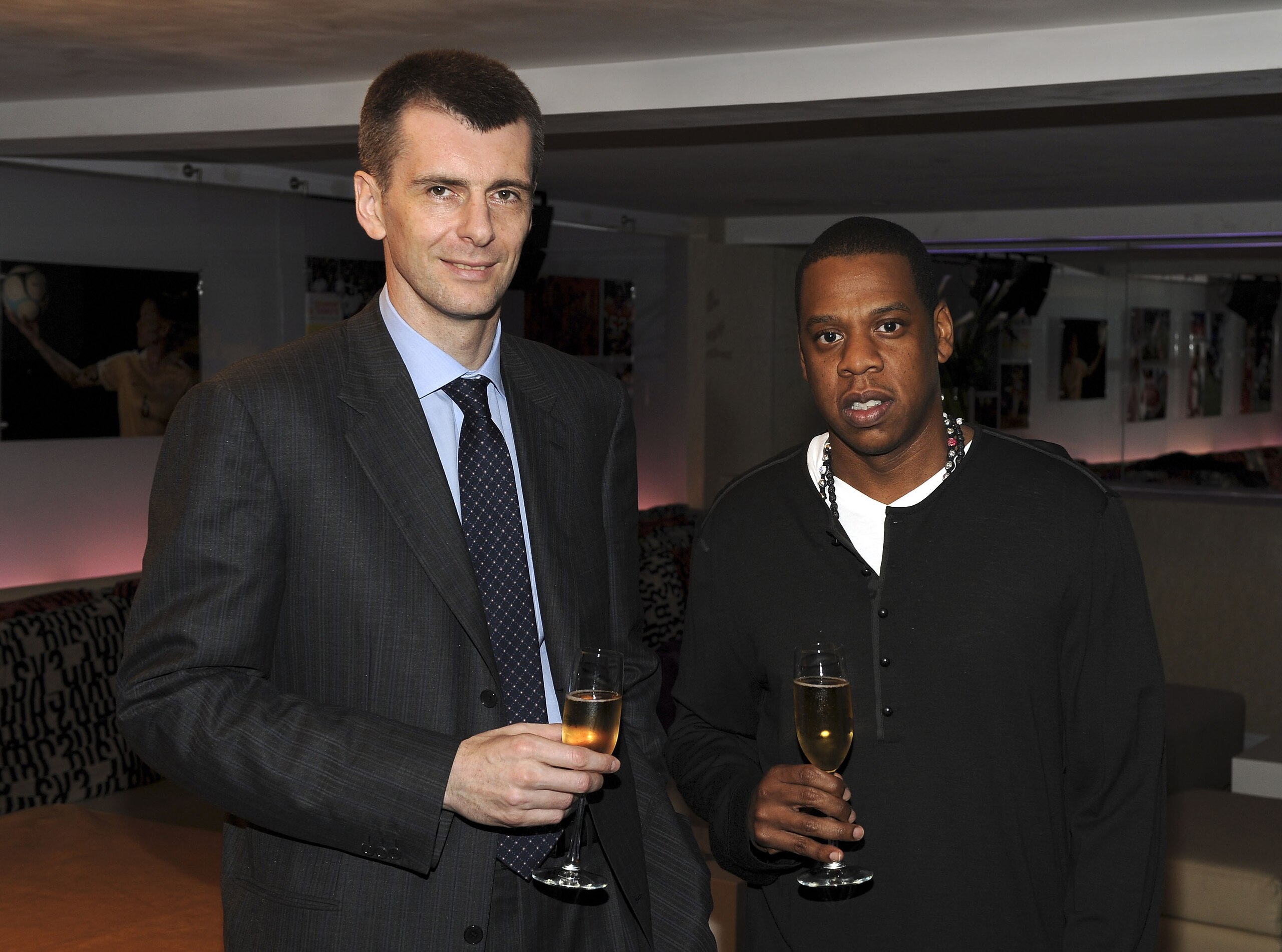 NEW YORK - MAY 18: (EXCLUSIVE) Nets owner Mikhail Prokhorov with cultural icon and Nets investor JAY-Z celebrate Prokhorov's purchase of the team at lunch today at JAY-Z's 40/40 club on May 18, 2010 in New York City. Prokhorov is representing the Nets to NEW YORK - MAY 18: (EXCLUSIVE) Nets owner Mikhail Prokhorov with cultural icon and Nets investor JAY-Z celebrate Prokhorov's purchase of the team at lunch today at JAY-Z's 40/40 club on May 18, 2010 in New York City. Prokhorov is representing the Nets to