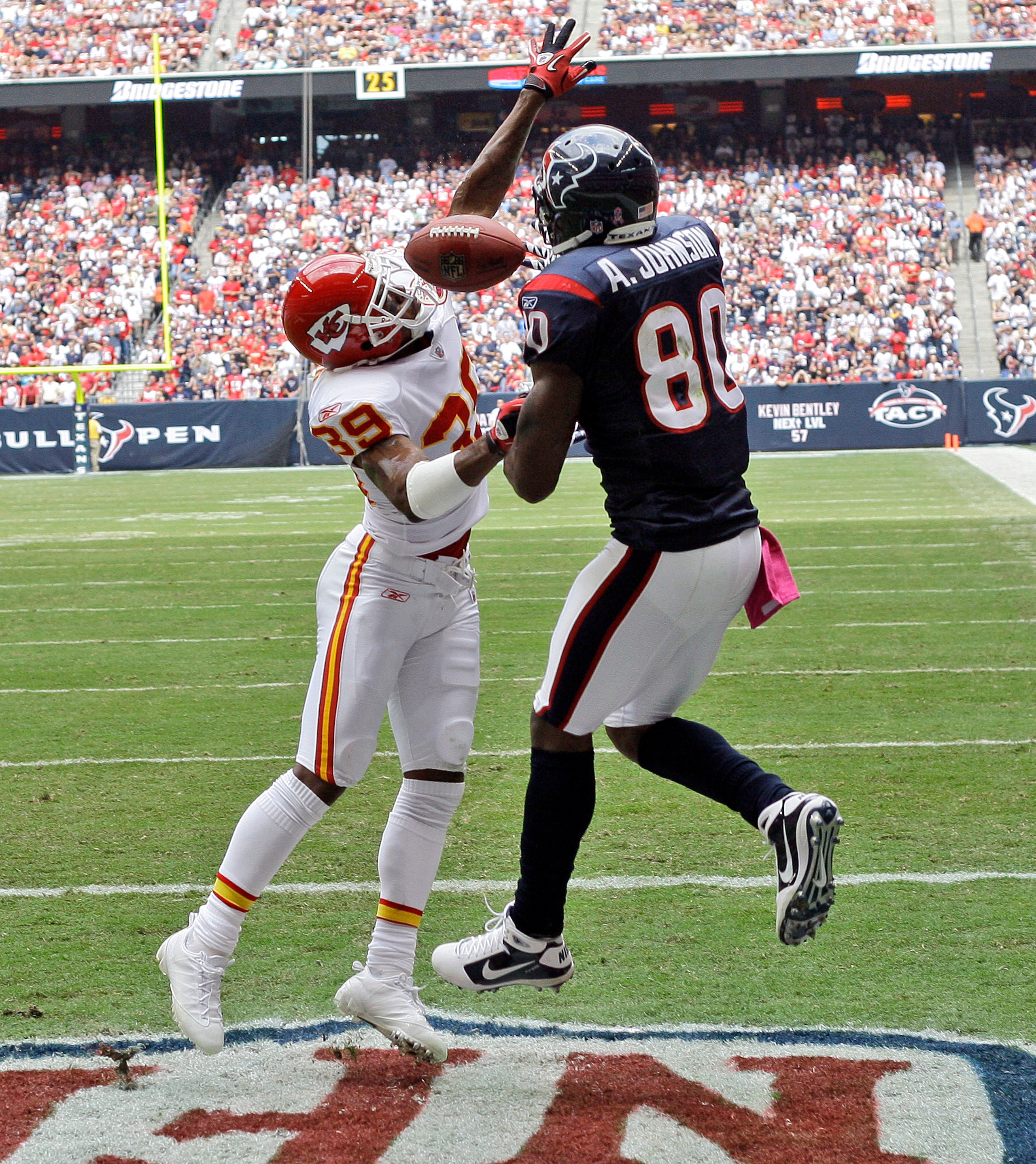 HOUSTON - OCTOBER 17:  Andre Johnson #80 of the Houston Texans has a pass broken up by cornerback Eric Berry #39 of the Kansas City Chiefs at Reliant Stadium on October 17, 2010 in Houston, Texas.  (Photo by Bob Levey/Getty Images)