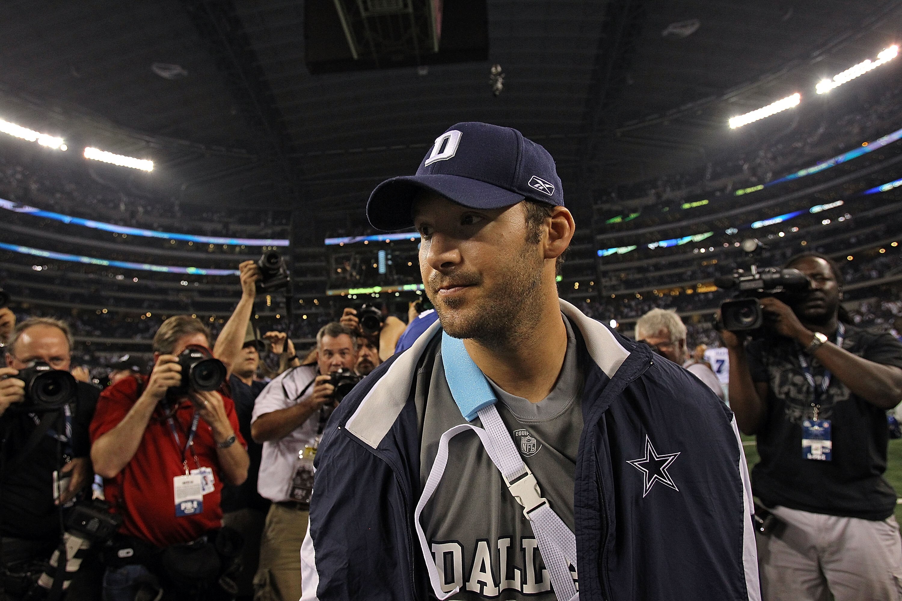 ARLINGTON, TX - OCTOBER 25:  Quarterback Tony Romo #9 of the Dallas Cowboys walks off the field wearing an arm sling after a 41-35 loss against the New York Giants at Cowboys Stadium on October 25, 2010 in Arlington, Texas.  (Photo by Ronald Martinez/Gett