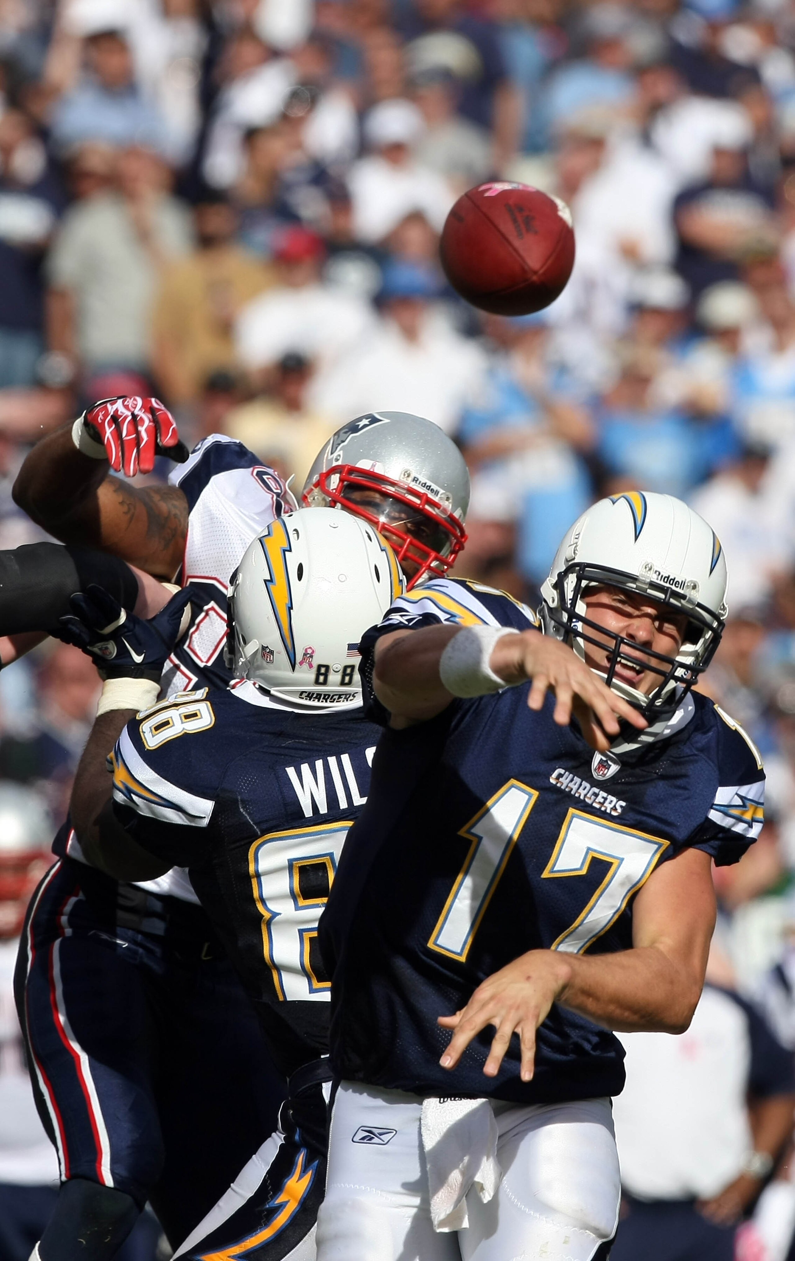 SAN DIEGO - OCTOBER 24: Quarterback Philip Rivers #17 of the San Diego Chargers throws the ball against the pressure of the New England Patriots defense during NFL game on October 24, 2010 at Qualcomm Stadium in San Diego, California. (Photo by Donald Mi SAN DIEGO - OCTOBER 24: Quarterback Philip Rivers #17 of the San Diego Chargers throws the ball against the pressure of the New England Patriots defense during NFL game on October 24, 2010 at Qualcomm Stadium in San Diego, California. (Photo by Donald Mi