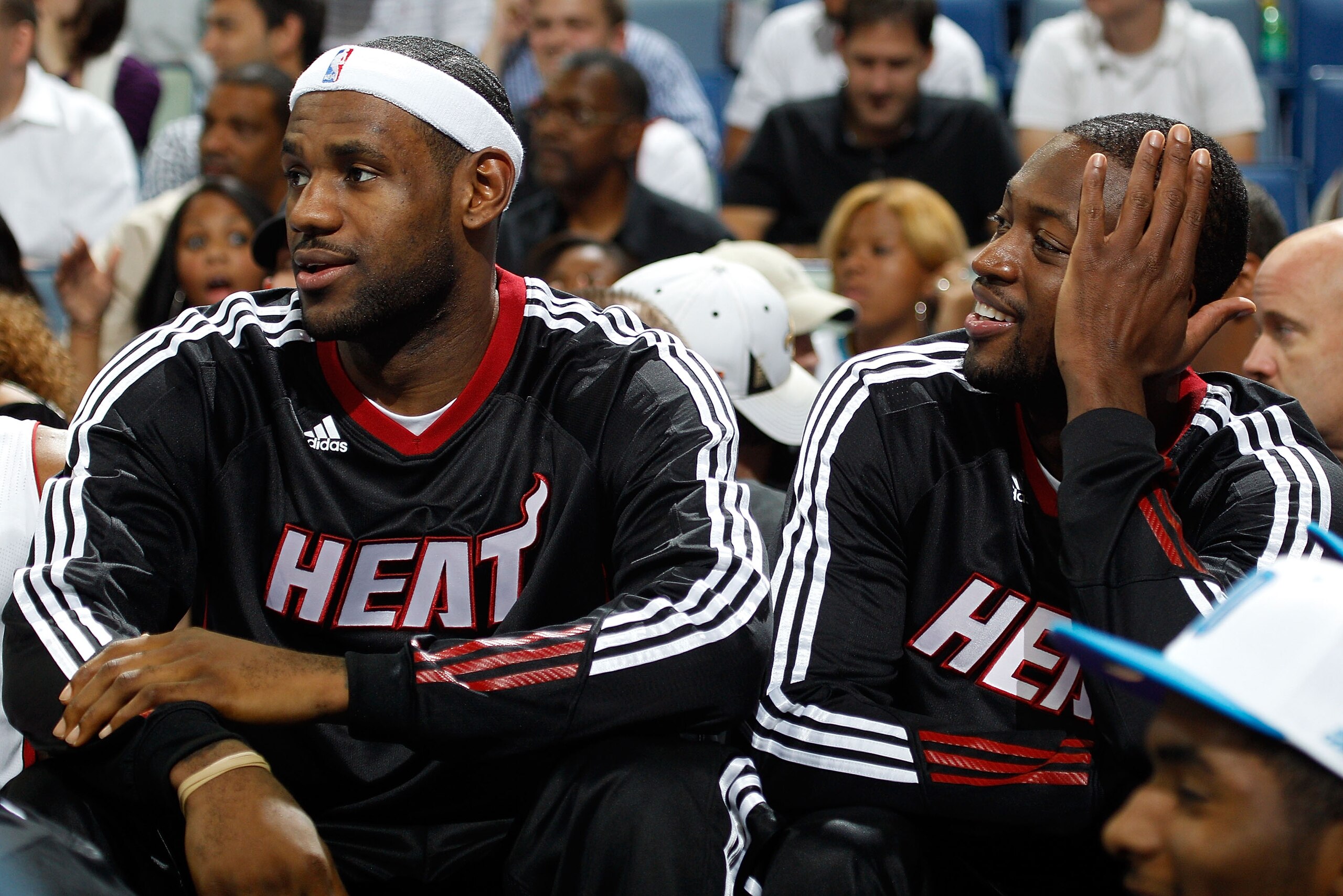 NEW ORLEANS - OCTOBER 13:  LeBron James #6 and Dwyane Wade #3 of the Miami Heat sit on the bench during the game against the New Orleans Hornets at the New Orleans Arena on October 13, 2010 in New Orleans, Louisiana.  NOTE TO USER: User expressly acknowle