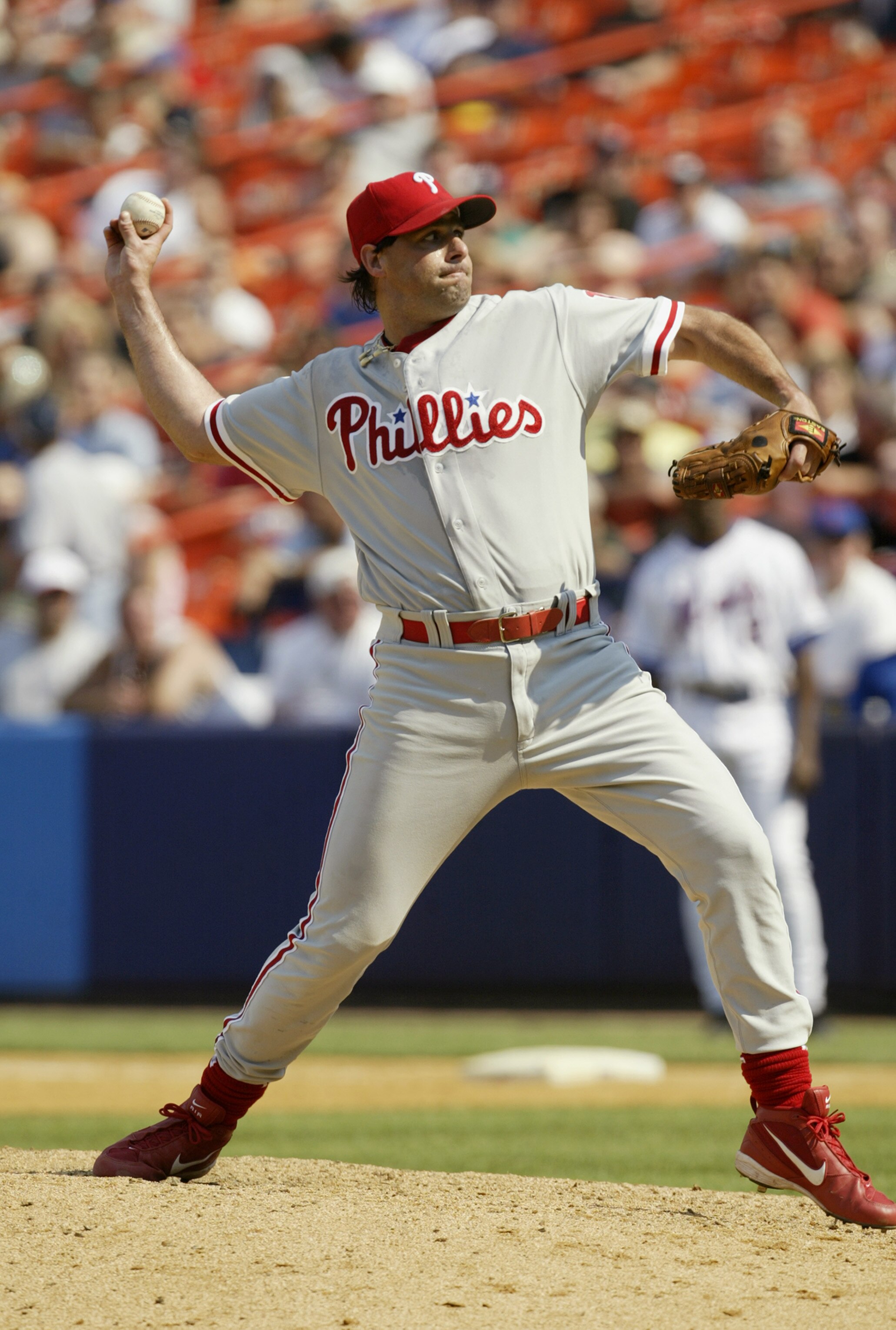 FLUSHING, NY - JULY 12:  Turk Wendell #13 of the Philadelphia Phillies pitches against the New York Mets on July 12, 2003 at Shea Stadium in Flushing, New York.  The Phillies defeated the Mets in 11 innings 4-2.  (Photo by Chris Trotman/Getty Images)
