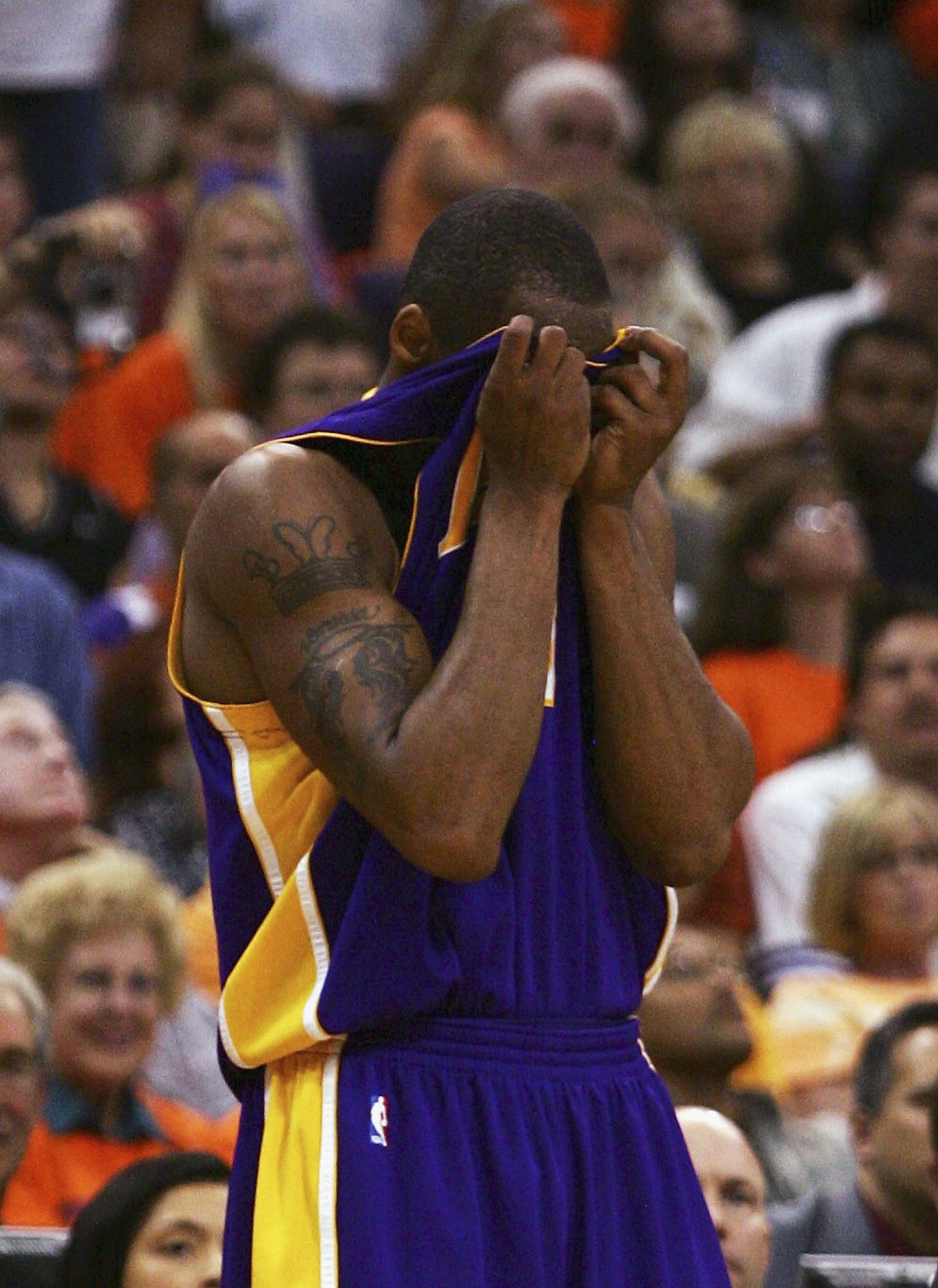 PHOENIX - MAY 2:  Kobe Bryant #8 of the Los Angeles Lakers reacts to a foul against the Phoenix Suns during the fourth quarter in Game 5 of the Western Conference Quarterfinals during the 2006 NBA Playoffs at the US Airways Center on May 2, 2006 in Phoeni