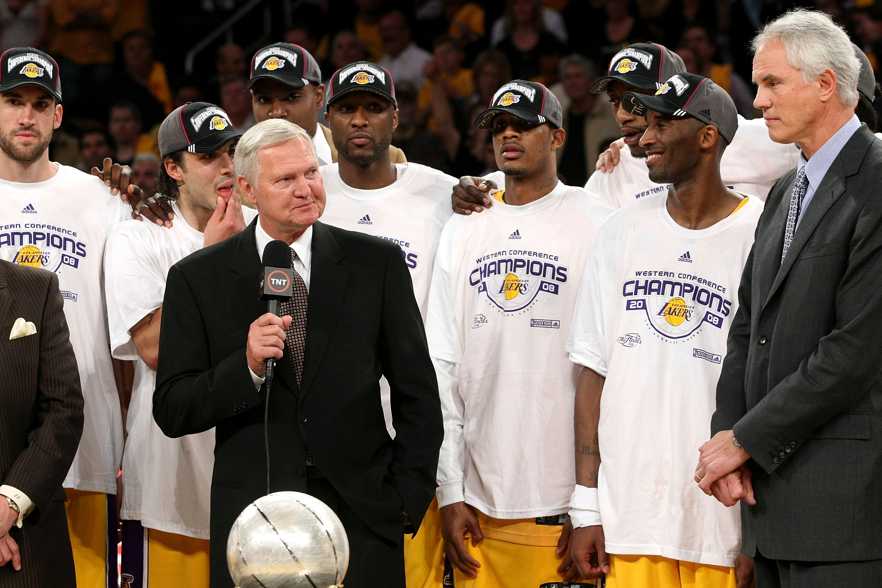 LOS ANGELES, CA - MAY 29:  Los Angeles Lakers legend Jerry West presents the Western Conference Championship trophy to General Manager Mitch Kupchak of the Los Angeles Lakers after they defeated the San Antonio Spurs in Game Five of the Western Conference