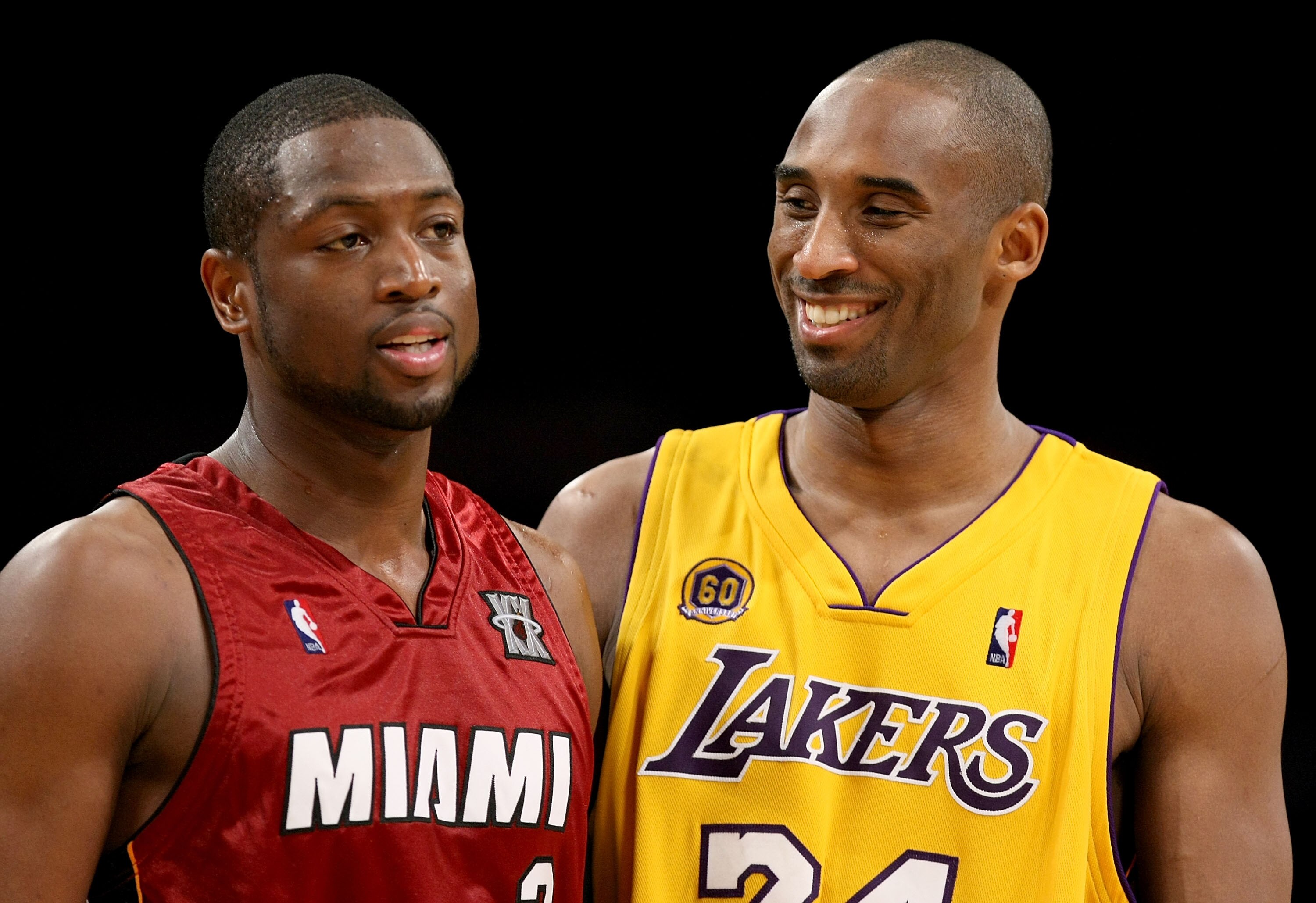 LOS ANGELES - FEBRUARY 28:   Dwayne Wade #3 of the Miami Heat and Kobe Bryant #24 of the Los Angeles Lakers talk during a break in the game on February 28, 2008 at Staples Center in Los Angeles, California.  The Lakers won 106-88. NOTE TO USER: User expre