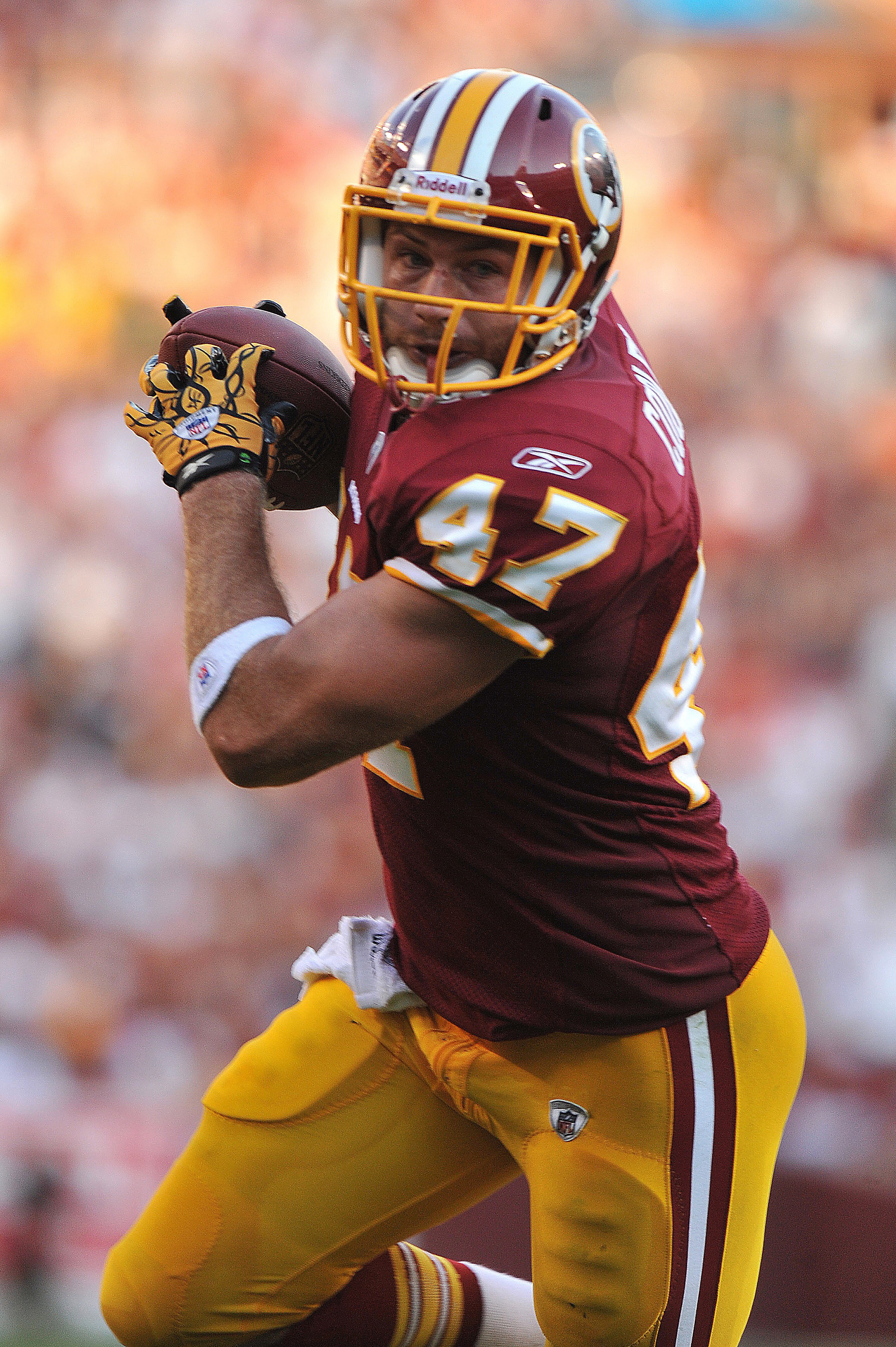 LANDOVER - SEPTEMBER 19:  Chris Cooley #47 of the Washington Redskins runs the ball in for a touchdown against the Houston Texans at FedExField on September 19, 2010 in Landover, Maryland. The Texans defeated the Redskins 30-27 in overtime. (Photo by Larr