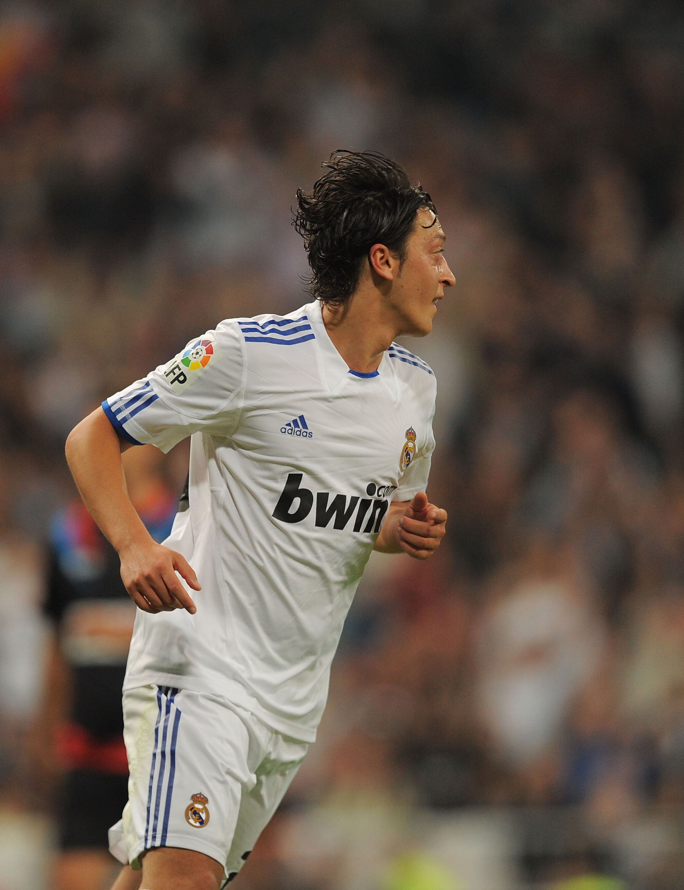 MADRID, SPAIN - OCTOBER 23:  Mesut Ozil of Real Madrid celebrates after scoring Real's 6th goal during the La Liga match between Real Madrid and Racing Santander at Estadio Santiago Bernabeu on October 23, 2010 in Madrid, Spain.  (Photo by Denis Doyle/Get