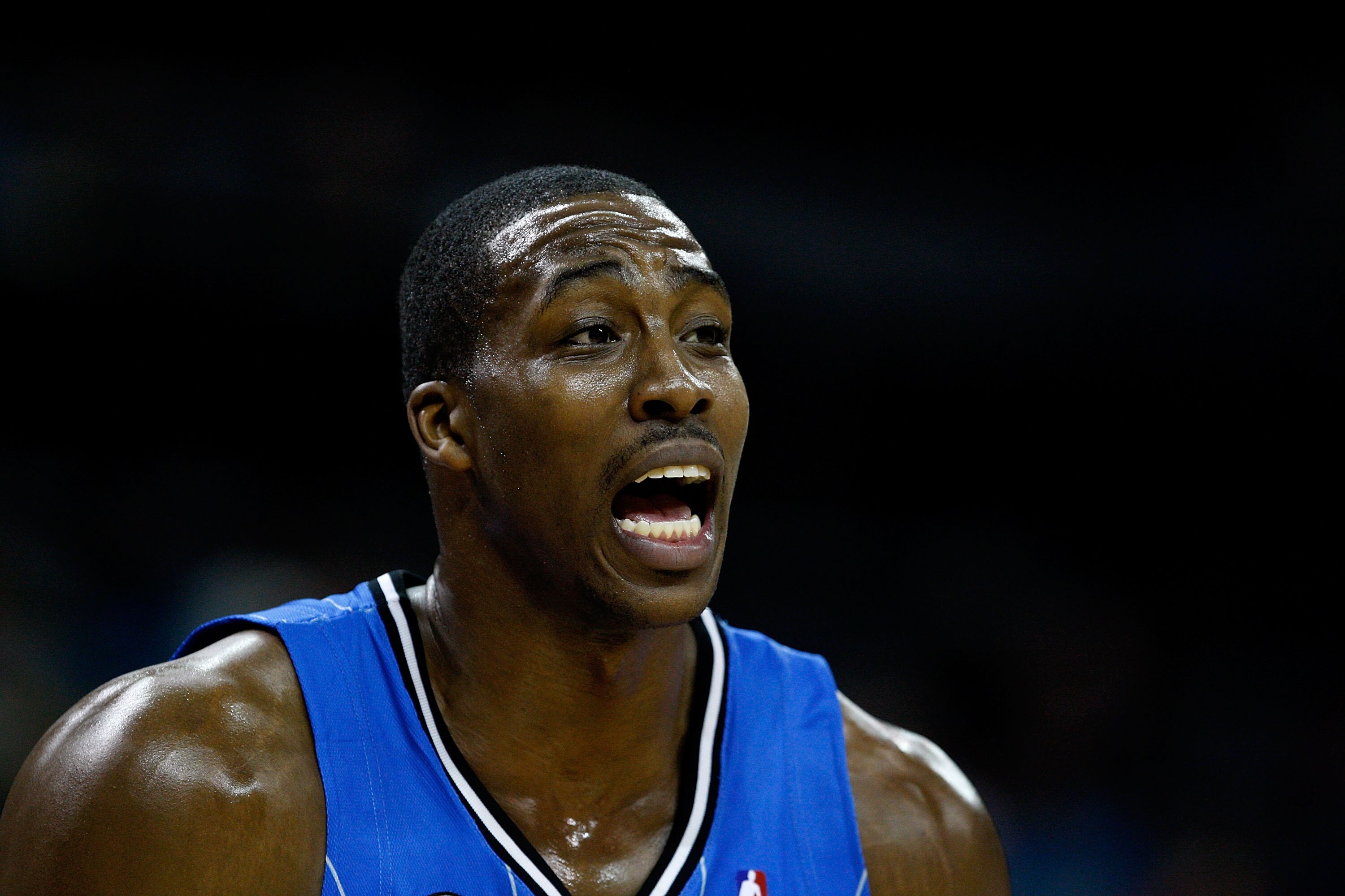 CHARLOTTE, NC - FEBRUARY 20:  Dwight Howard #12 of the Orlando Magic yells to a teammate after scoring a basket against Charlotte Bobcats during their game at Time Warner Cable Arena on February 20, 2009 in Charlotte, North Carolina. NOTE TO USER: User ex