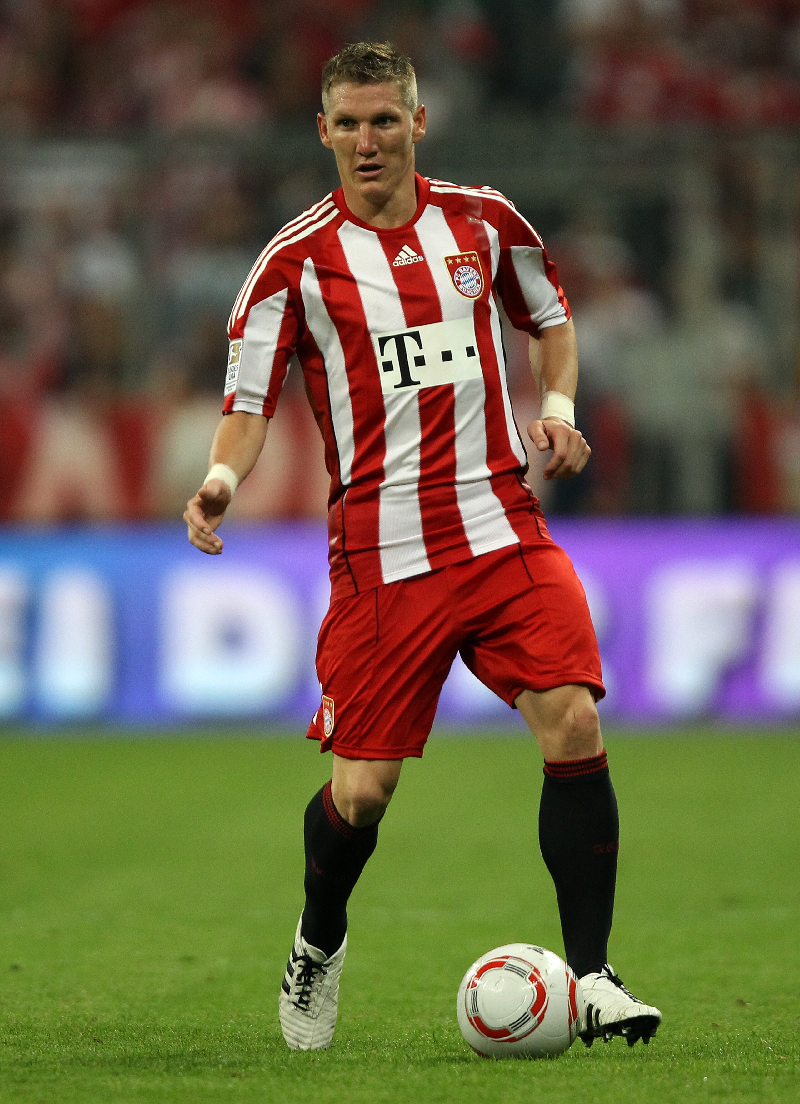 MUNICH, GERMANY - AUGUST 20: Bastian Schweinsteiger of Bayern runs with the ball during the Bundesliga match between FC Bayern Muenchen and VfL Wolfsburg at Allianz Arena on August 20, 2010 in Munich, Germany. (Photo by Clive Brunskill/Getty Images) MUNICH, GERMANY - AUGUST 20: Bastian Schweinsteiger of Bayern runs with the ball during the Bundesliga match between FC Bayern Muenchen and VfL Wolfsburg at Allianz Arena on August 20, 2010 in Munich, Germany. (Photo by Clive Brunskill/Getty Images)