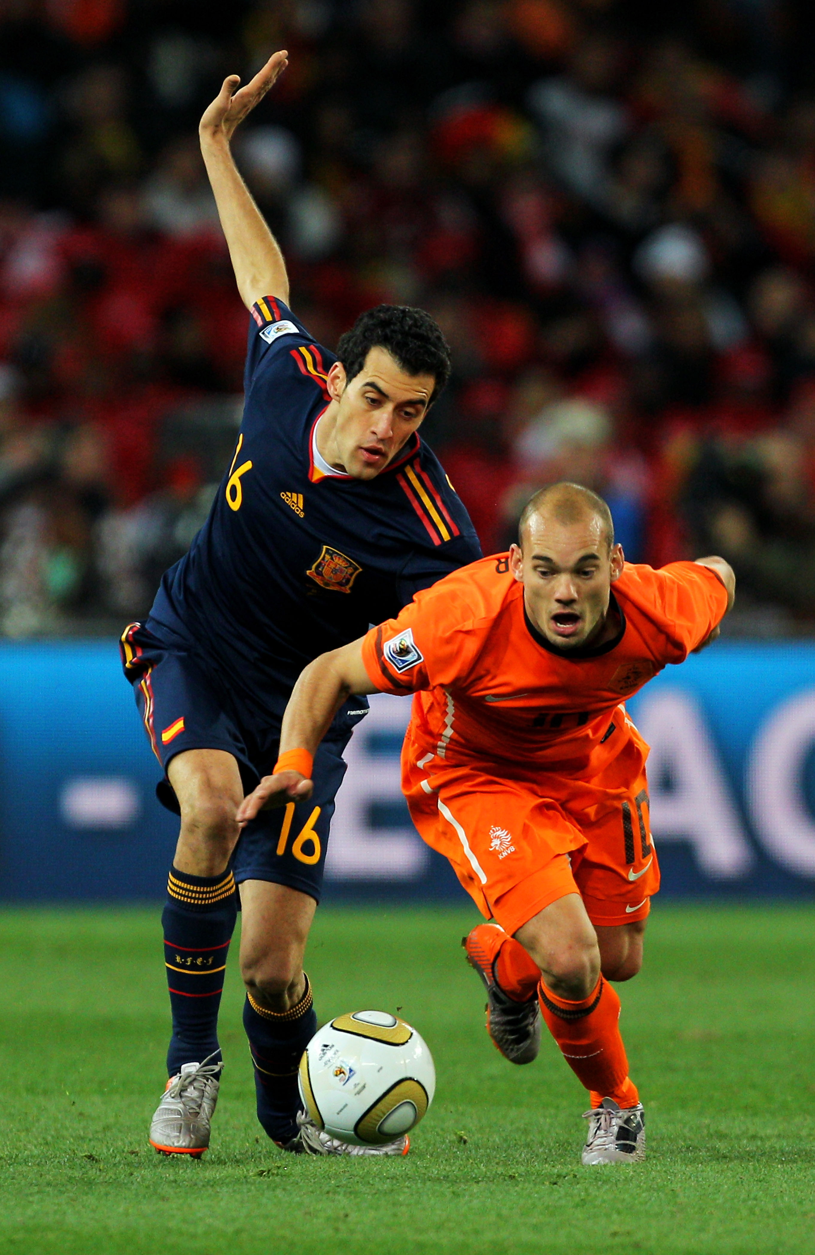 JOHANNESBURG, SOUTH AFRICA - JULY 11: Sergio Busquets of Spain and Wesley Sneijder of the Netherlands battle for the ball during the 2010 FIFA World Cup South Africa Final match between Netherlands and Spain at Soccer City Stadium on July 11, 2010 in Joha