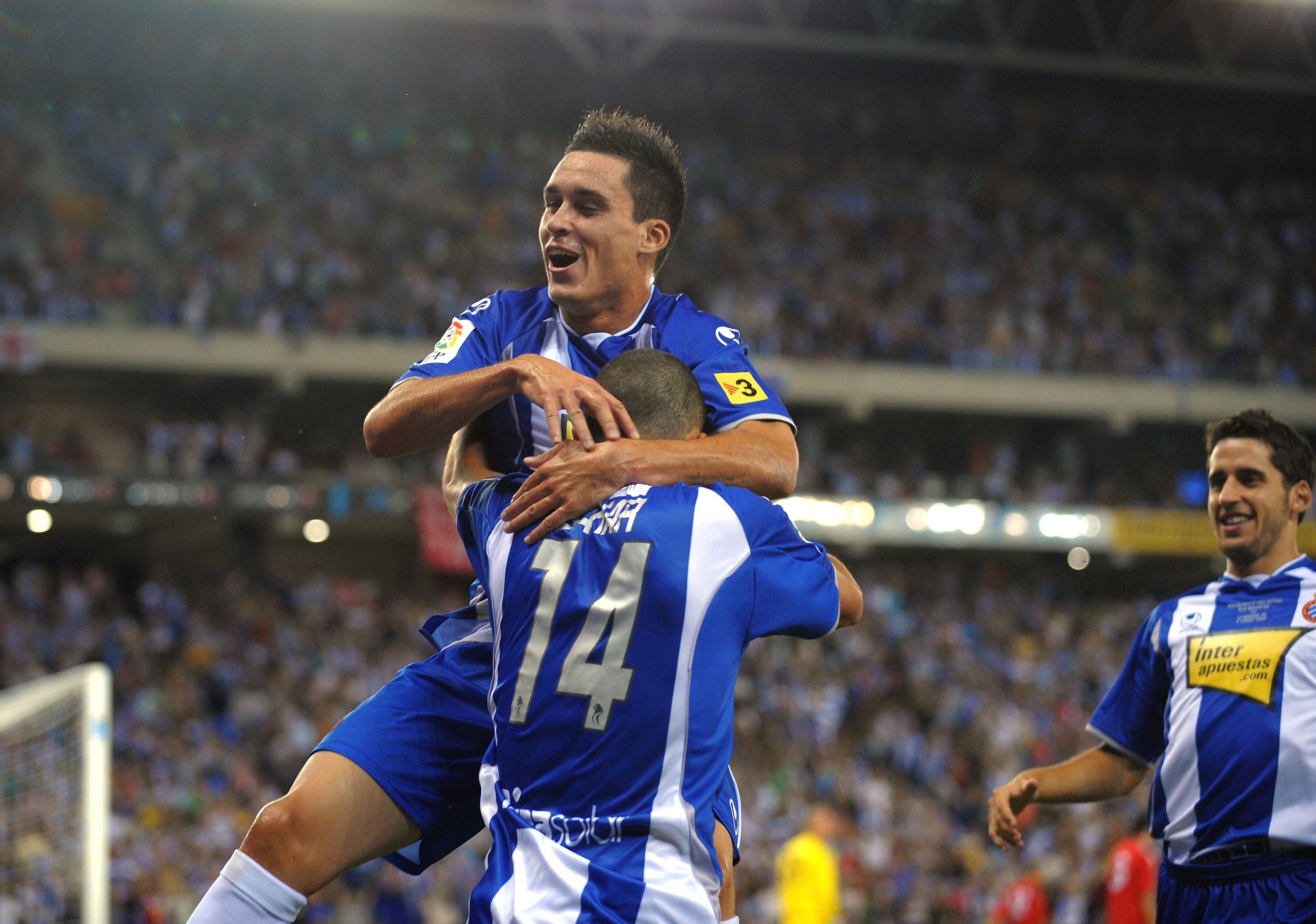 BARCELONA, SPAIN - AUGUST 02: Jose Callejon of RCD Espanyol celebrates with Ben Sahar (#14) after Sahar scored a goal against Liverpool during a pre- season friendly match at the Nuevo Estadio de Cornella-El Prat stadium on August 2, 2009 in Barcelona, Sp