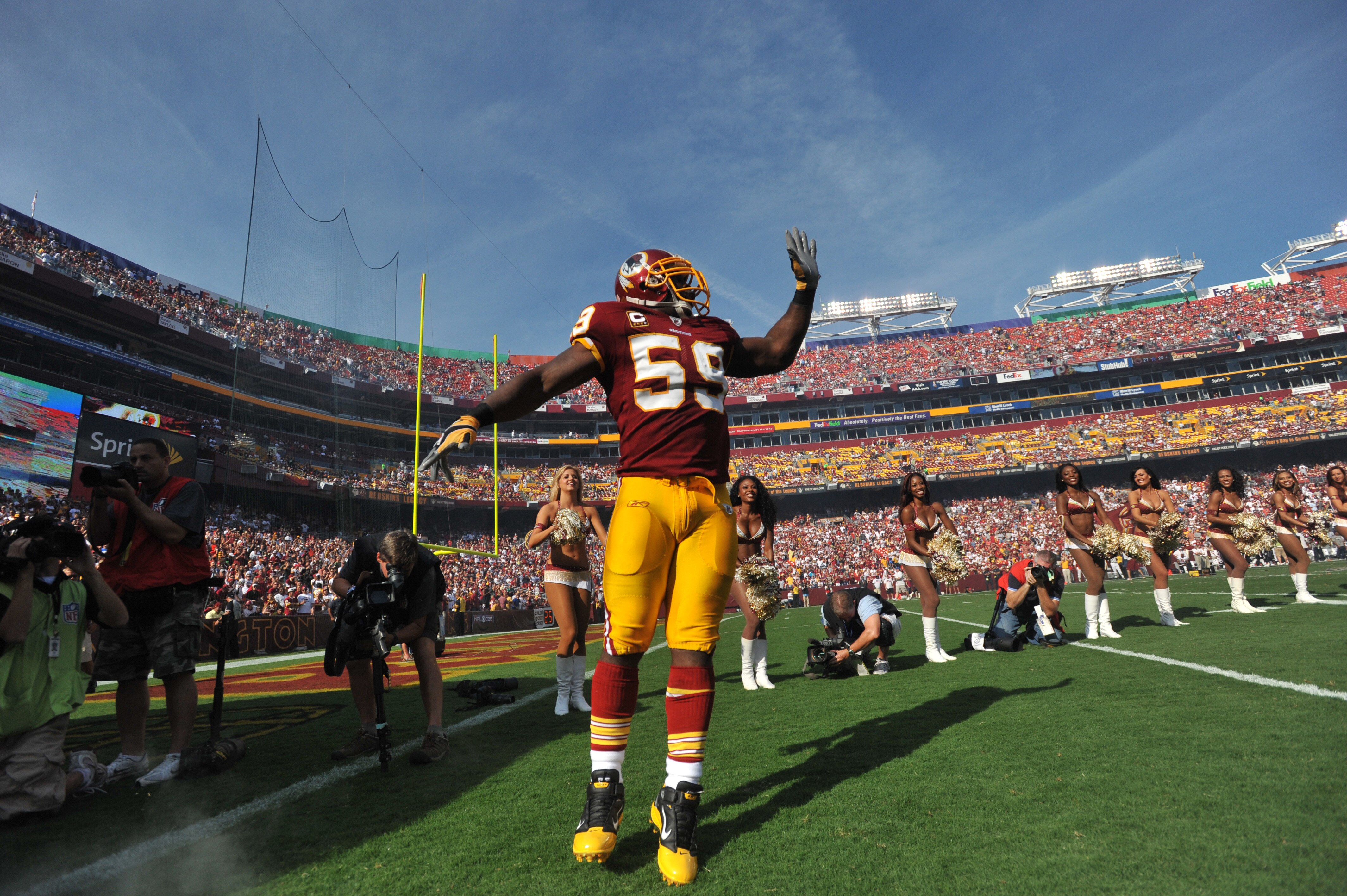 LANDOVER - SEPTEMBER 19:  London Fletcher #59 of the Washington Redskins is introduced before the game against the Houston Texans at FedExField on September 19, 2010 in Landover, Maryland. The Texans defeated the Redskins 30-27 in overtime. (Photo by Larr