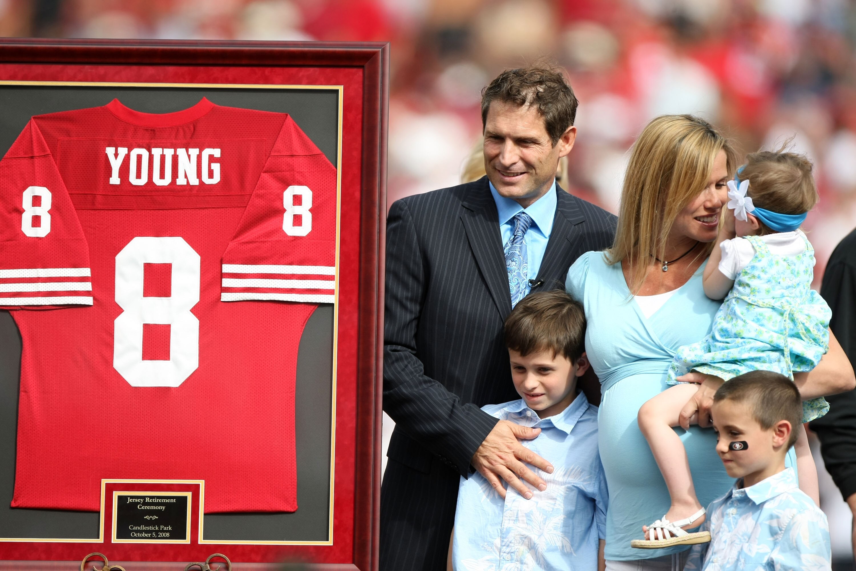 SAN FRANCISCO - OCTOBER 05:  Former San Francisco 49ers quarterback Steve Young poses for picture with his family during a ceremony to retire his number at halftime of the New England Patriots and the San Francisco 49ers NFL game on October 5, 2008 at Can