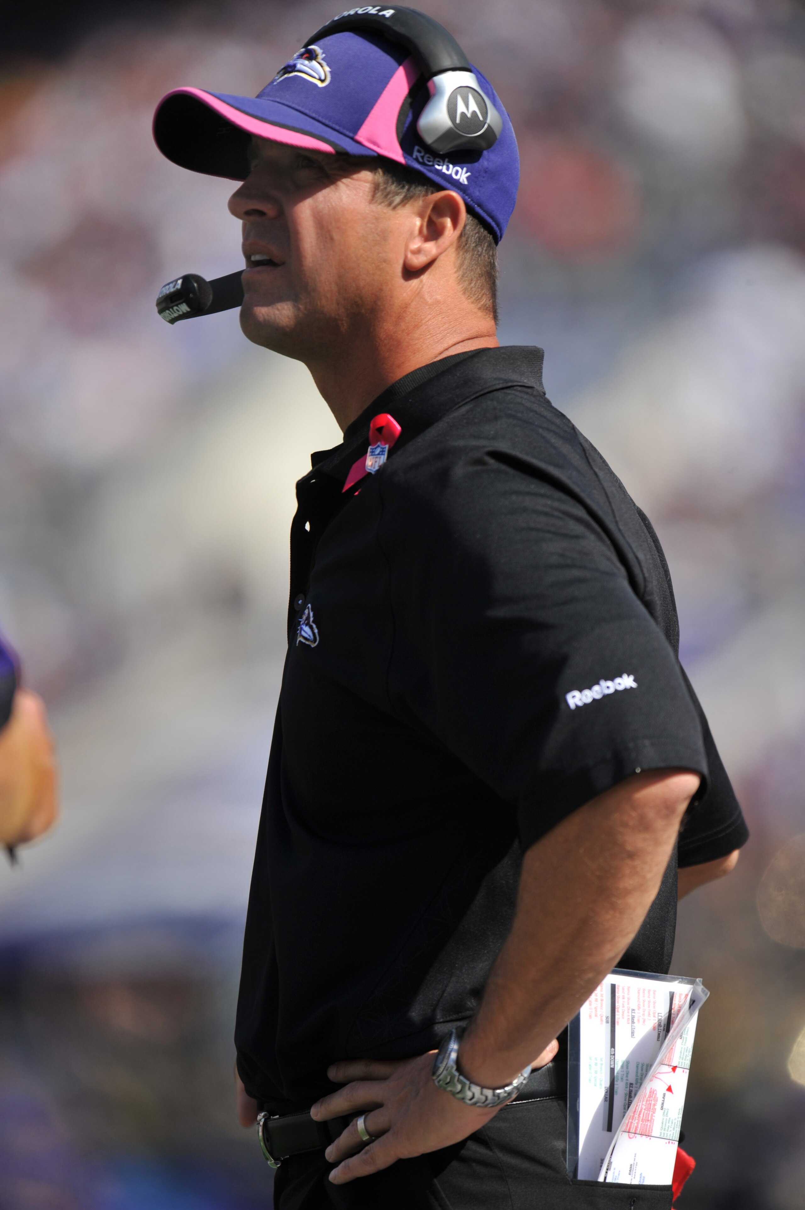 BALTIMORE, MD - OCTOBER 10: Head coach John Harbaugh of the Baltimore Ravens coaches against the Denver Broncos at M&T Bank Stadium on October 10, 2010 in Baltimore, Maryland. Players wore pink in recognition of Breast Cancer Awareness Month. The Ravens d