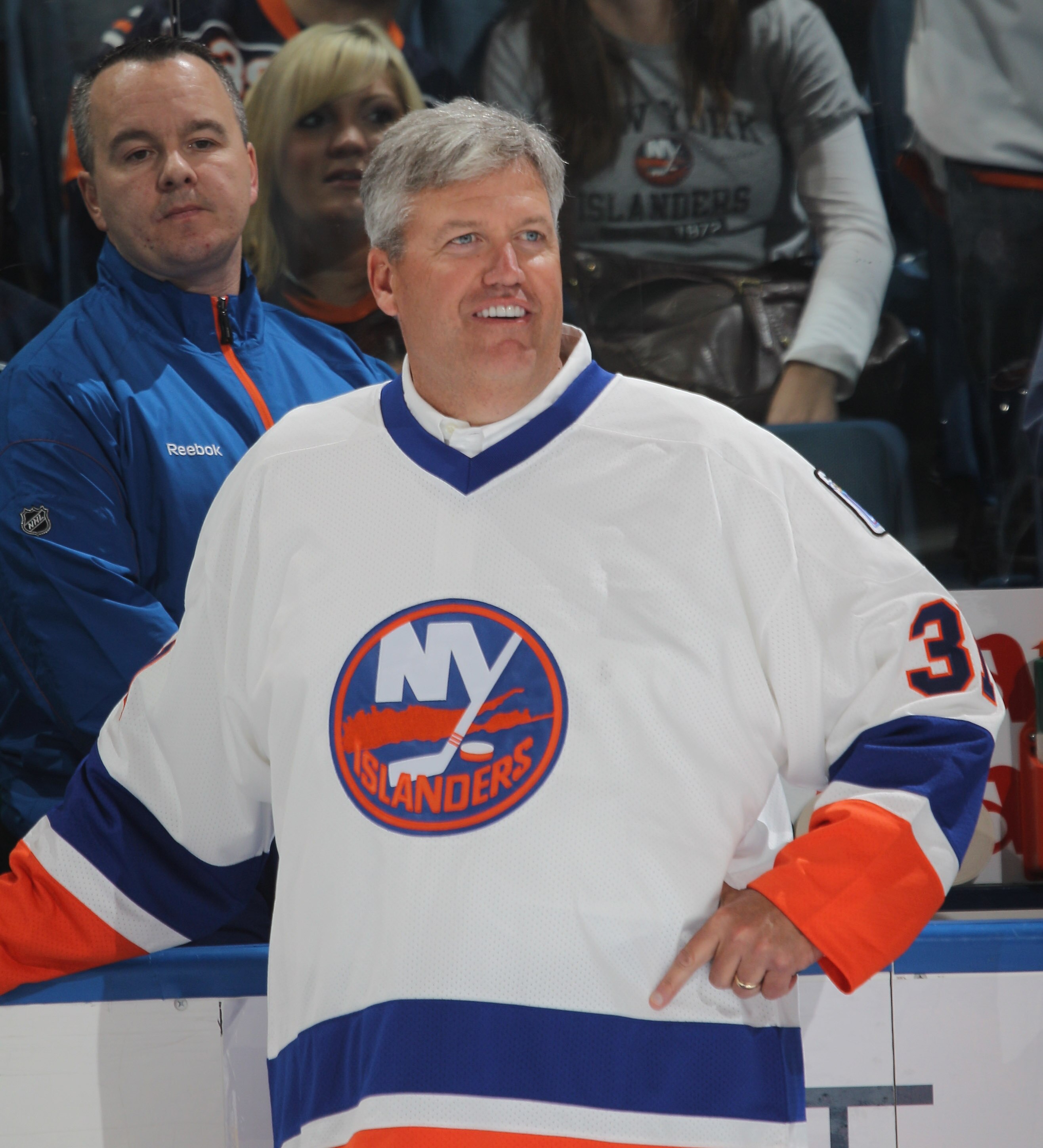UNIONDALE, NY - OCTOBER 09:  New York Jets coach Rex Ryan gets ready to drop the ceremonial puck between Brenden Morrow #10 of the Dallas Stars and Doug Weight #93 of the New York Islanders prior to the Islanders home opener at the Nassau Coliseum on Octo