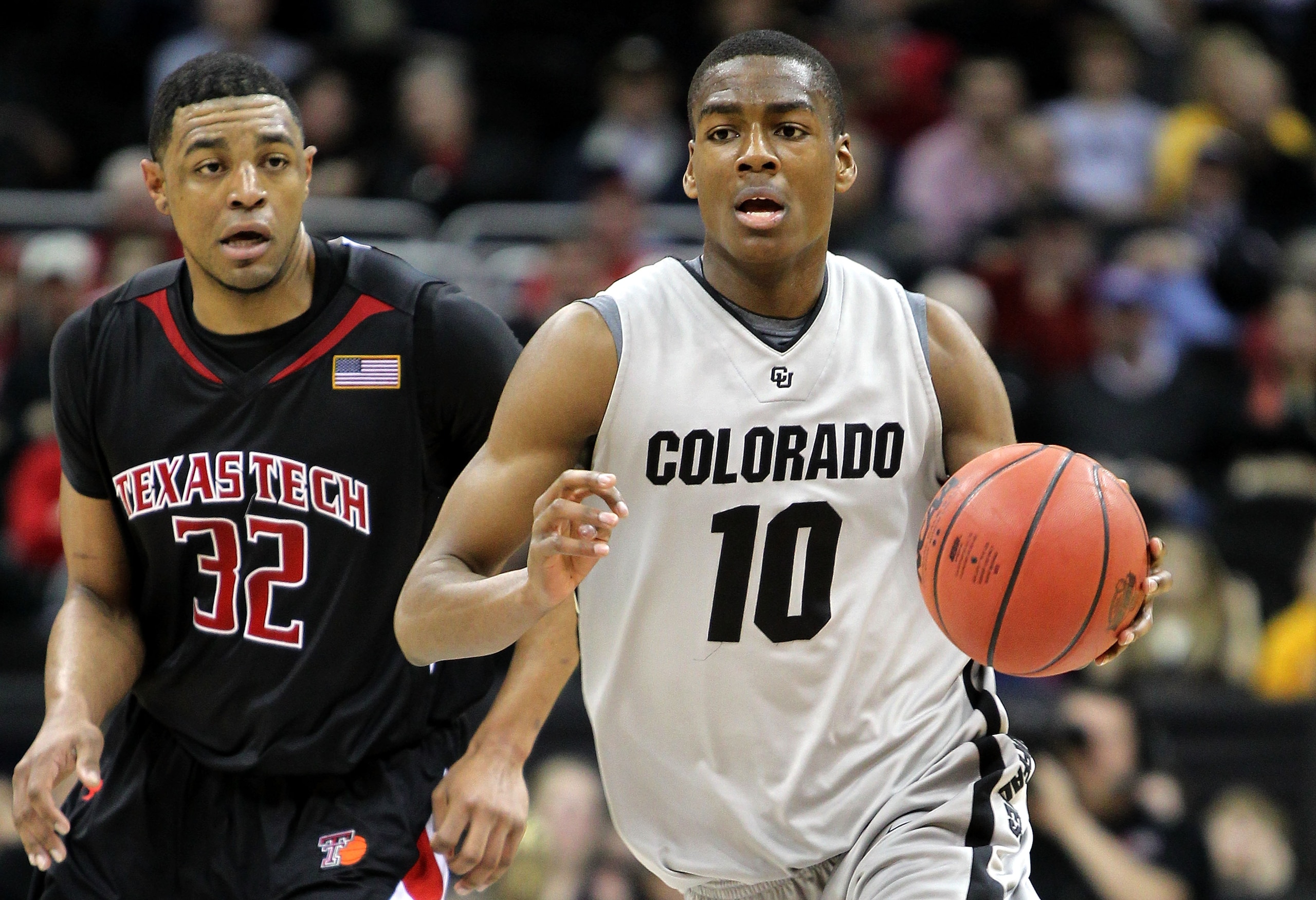 KANSAS CITY, MO - MARCH 10:  Alec Burks #10 of the Colorado Buffaloes moves the ball against Mike Singletary #32 of  the Texas Tech Red Raiders in the first half during the first round game of the 2010 Phillips 66 Big 12 Men's Basketball Tournament at the