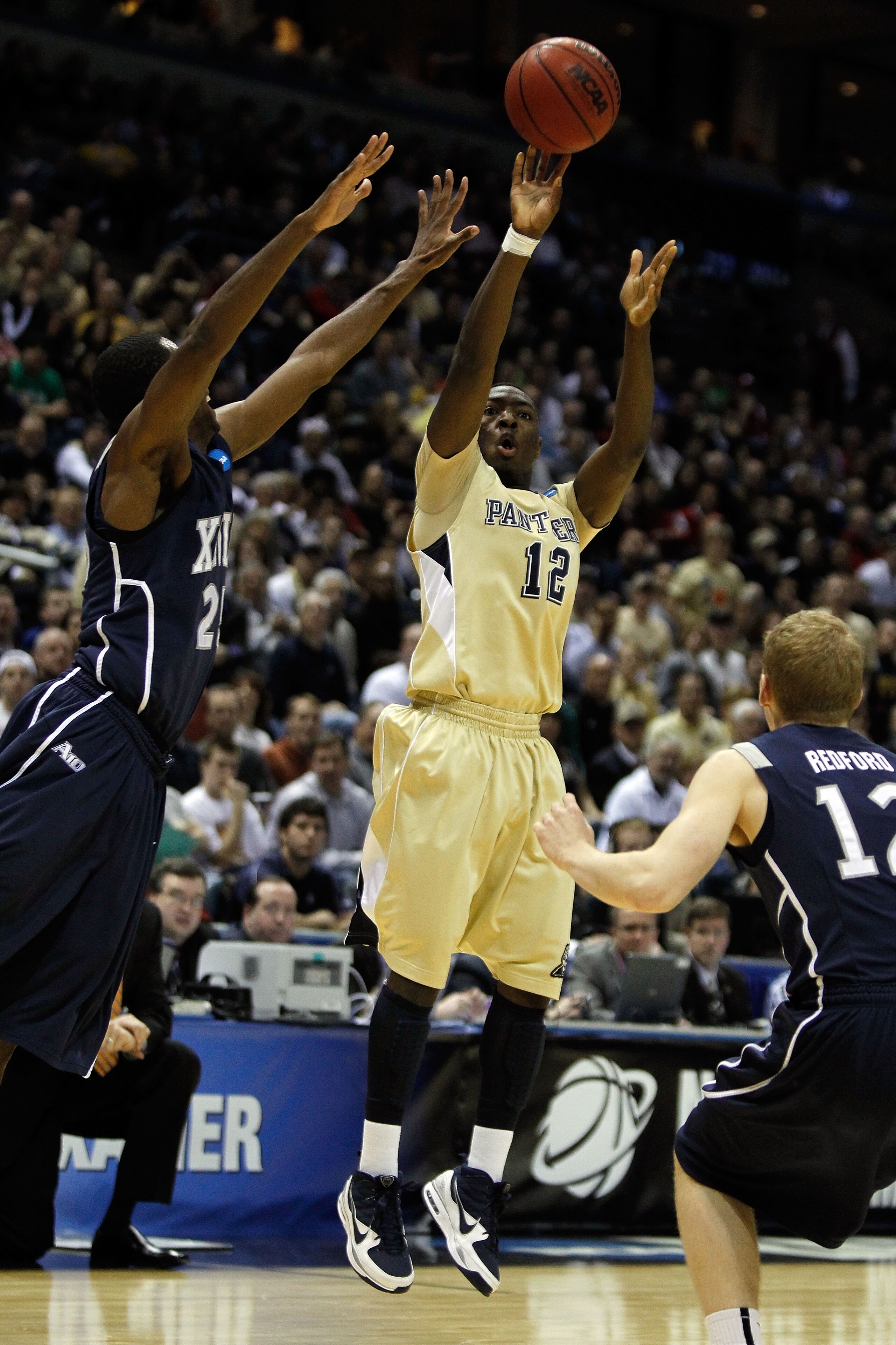 MILWAUKEE - MARCH 21:  Ashton Gibbs #12 of the Pittsburgh Panthers shoots the ball in the first half while taking on the Xavier Musketeers during the second round of the 2010 NCAA men's basketball tournament at the Bradley Center on March 21, 2010 in Milw