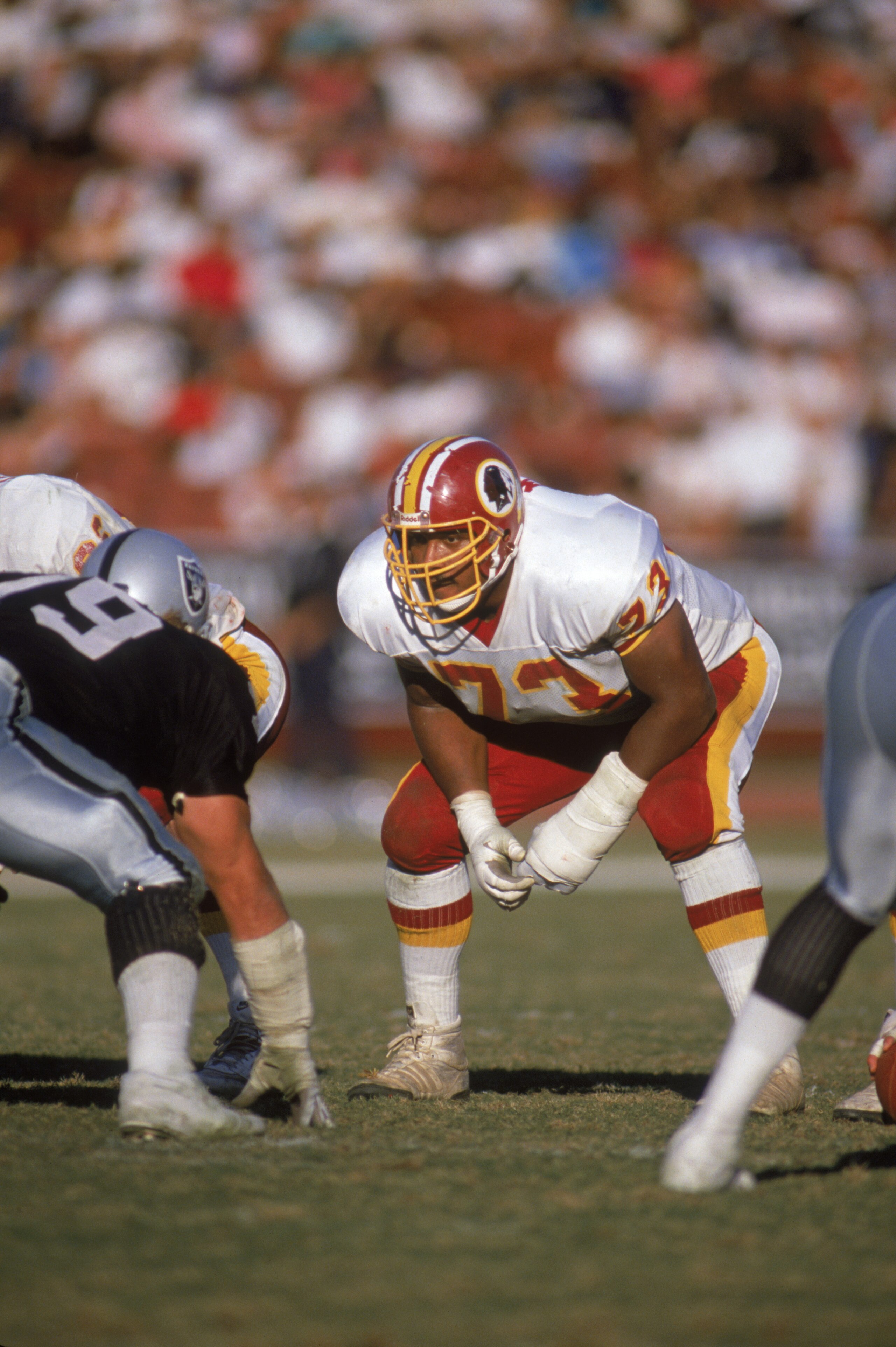 WASHINGTON - OCTOBER 29:  Mark May #73 of the Washington Redskins gets ready for the snap during a game against the Los Angeles Raiders on October 29,1989 at Los Angeles Coliseum in Los Angeles, California. The Raiders won 37-24. (Photo by: Stephen Dunn/G