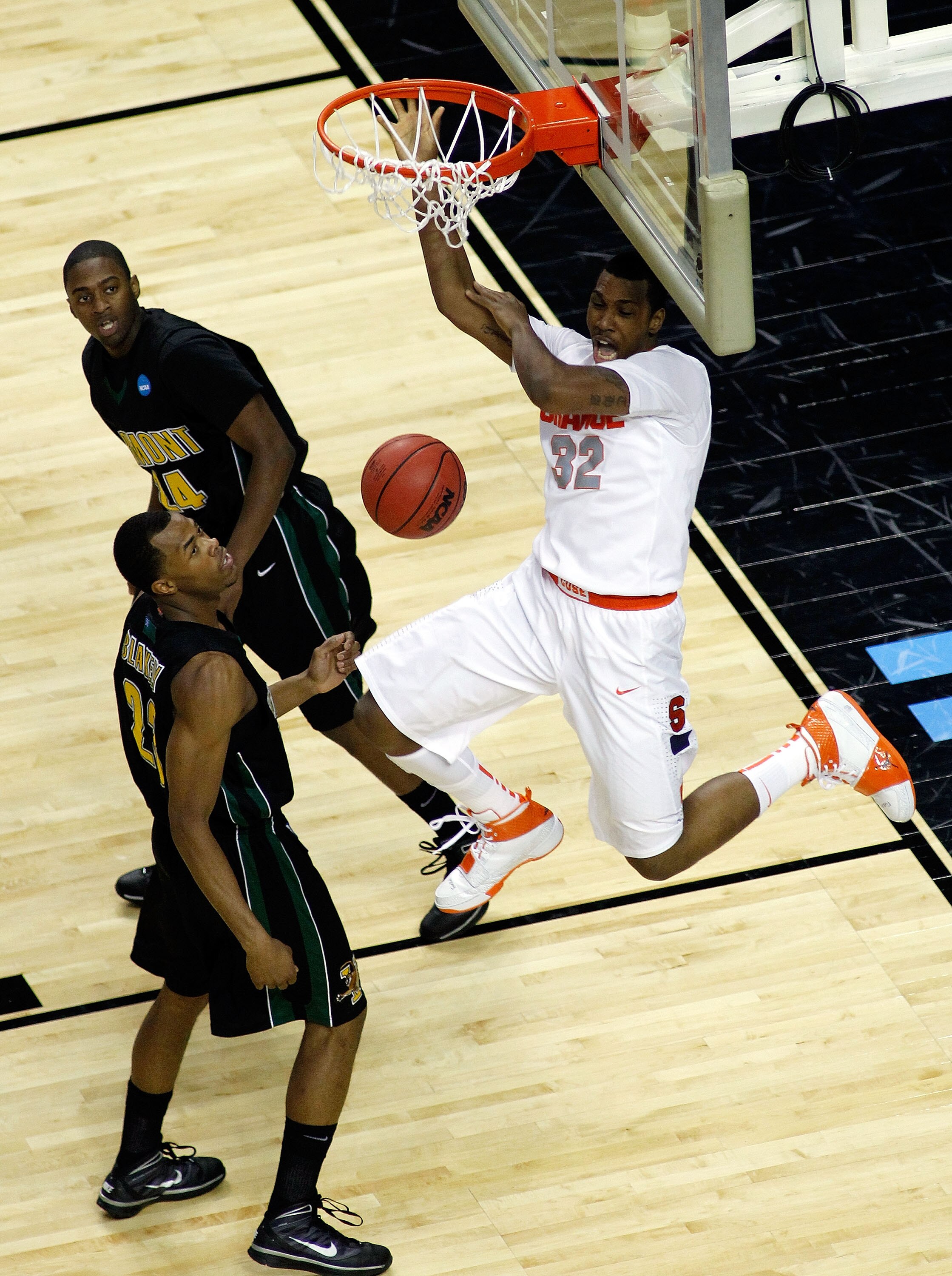BUFFALO, NY - MARCH 19:  Kris Joseph #32 of the Syracuse Orange dunks the ball against Marqus Blakely #23 and Maurice Joseph #24 of the Vermont Catamounts during the first round of the 2010 NCAA men's basketball tournament at HSBC Arena on March 19, 2010