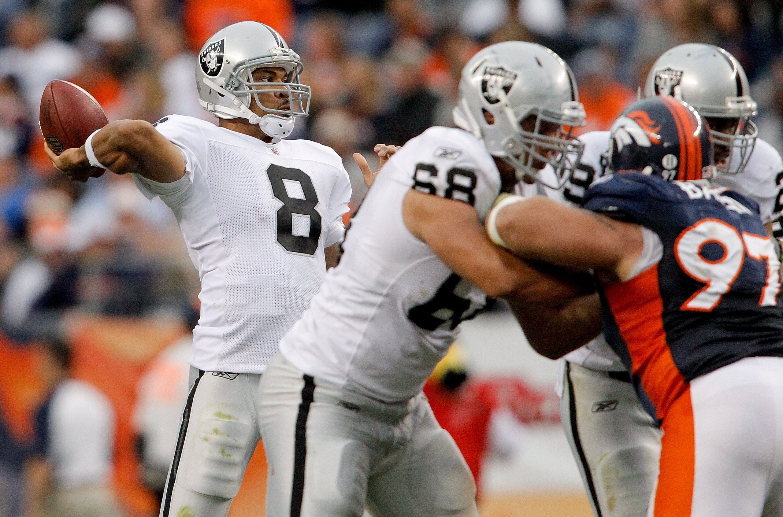 DENVER - OCTOBER 24: Quarterback Jason Campbell #8 of the Oakland Raiders makes a pass against the Denver Broncos in the third quarter at INVESCO Field at Mile High on October 24, 2010 in Denver, Colorado. The Raiders defeated the Broncos 59-14. (Photo b DENVER - OCTOBER 24: Quarterback Jason Campbell #8 of the Oakland Raiders makes a pass against the Denver Broncos in the third quarter at INVESCO Field at Mile High on October 24, 2010 in Denver, Colorado. The Raiders defeated the Broncos 59-14. (Photo b