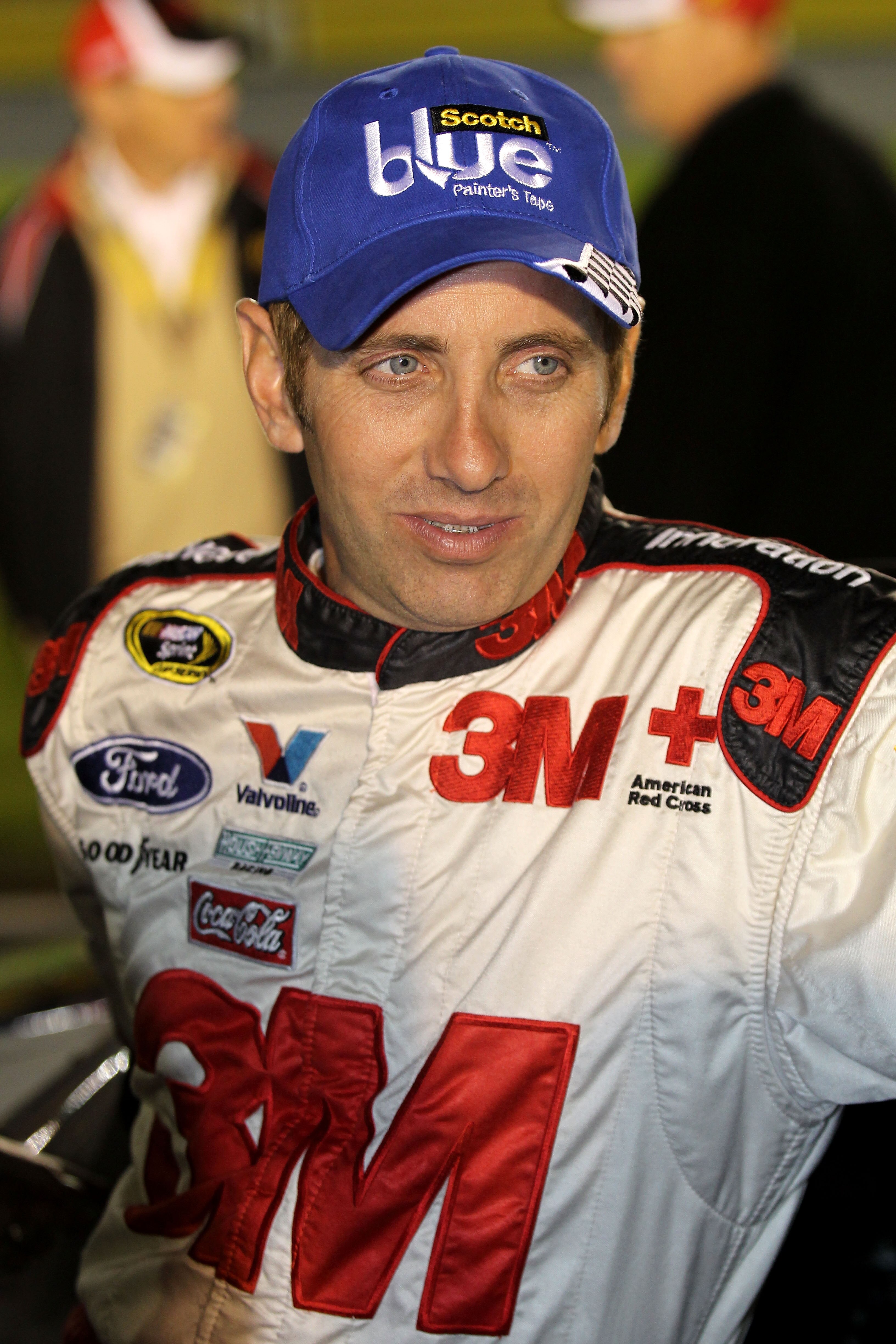 CONCORD, NC - OCTOBER 16:  Greg Biffle, driver of the #16 Scotch Blue Ford, stands on the grid prior to the NASCAR Sprint Cup Series Bank of America 500 at Charlotte Motor Speedway on October 16, 2010 in Concord, North Carolina.  (Photo by Tom Whitmore/Ge