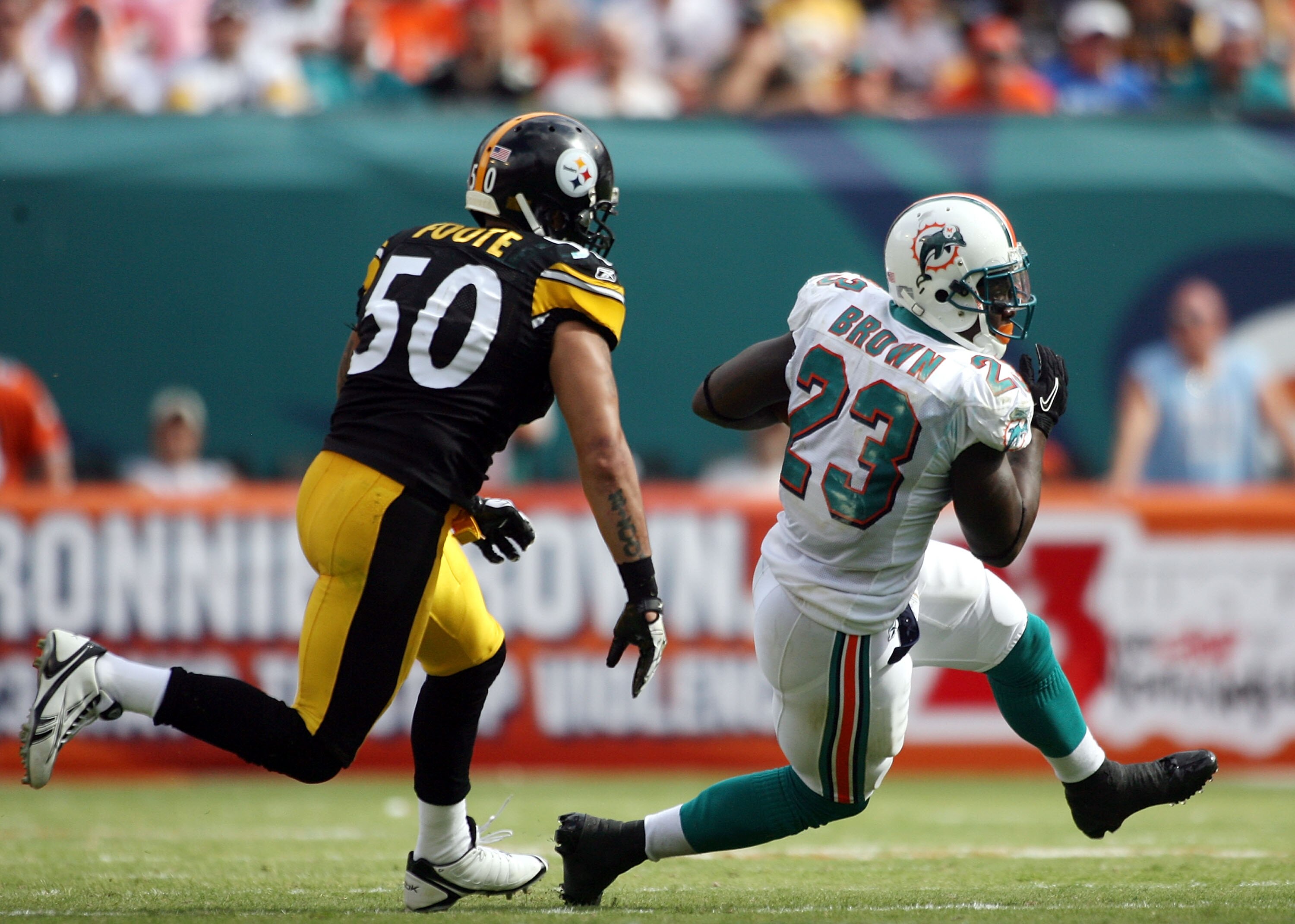 MIAMI - OCTOBER 24: Running back Ronnie Brown #23 eludes linebacker Larry Foote #50 of the Pittsburgh Steelers at Sun Life Stadium on October 24, 2010 in Miami, Florida. (Photo by Marc Serota/Getty Images) MIAMI - OCTOBER 24: Running back Ronnie Brown #23 eludes linebacker Larry Foote #50 of the Pittsburgh Steelers at Sun Life Stadium on October 24, 2010 in Miami, Florida. (Photo by Marc Serota/Getty Images)