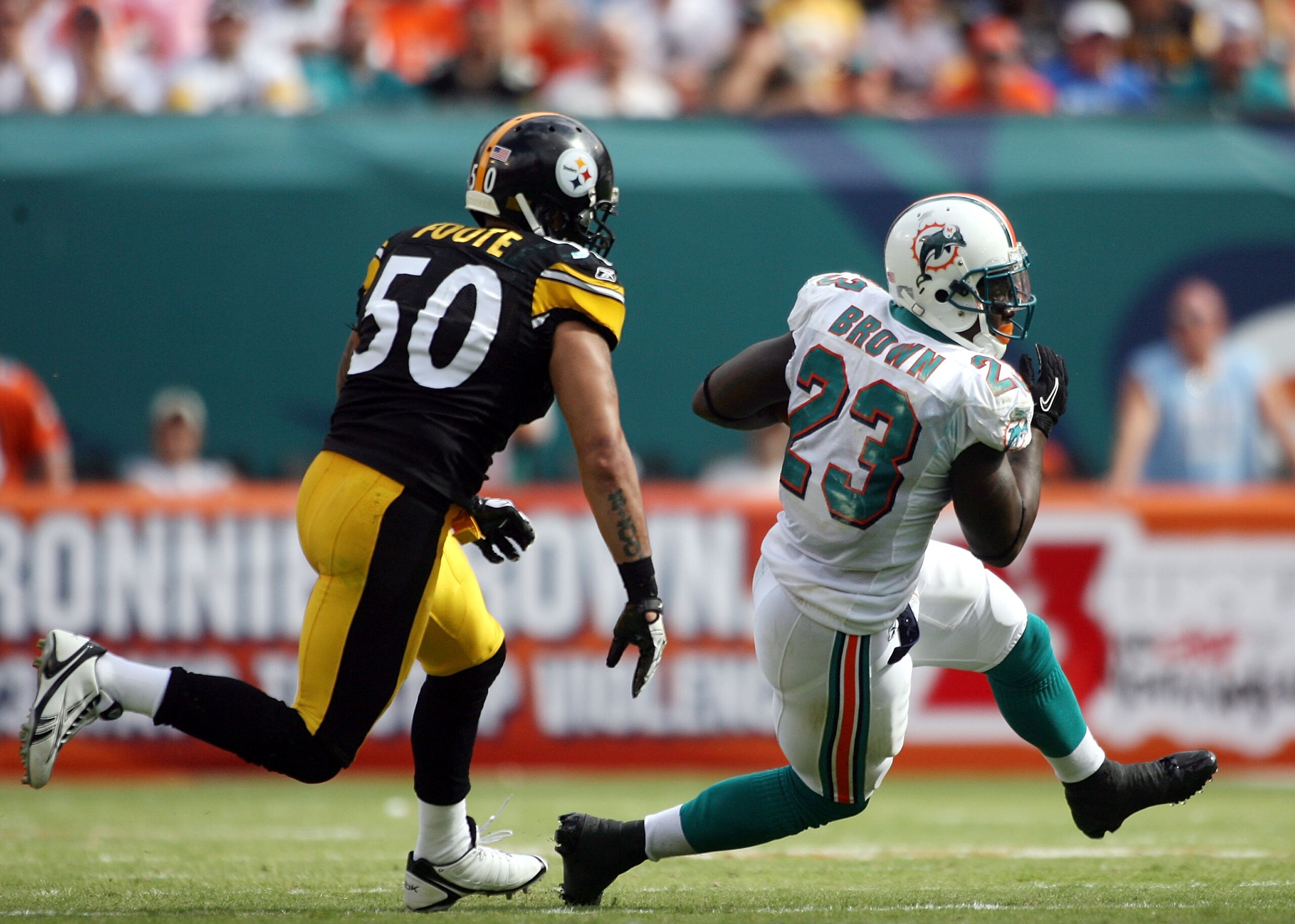 MIAMI - OCTOBER 24: Running back Ronnie Brown #23 eludes linebacker Larry Foote #50 of the Pittsburgh Steelers at Sun Life Stadium on October 24, 2010 in Miami, Florida. (Photo by Marc Serota/Getty Images) MIAMI - OCTOBER 24: Running back Ronnie Brown #23 eludes linebacker Larry Foote #50 of the Pittsburgh Steelers at Sun Life Stadium on October 24, 2010 in Miami, Florida. (Photo by Marc Serota/Getty Images)