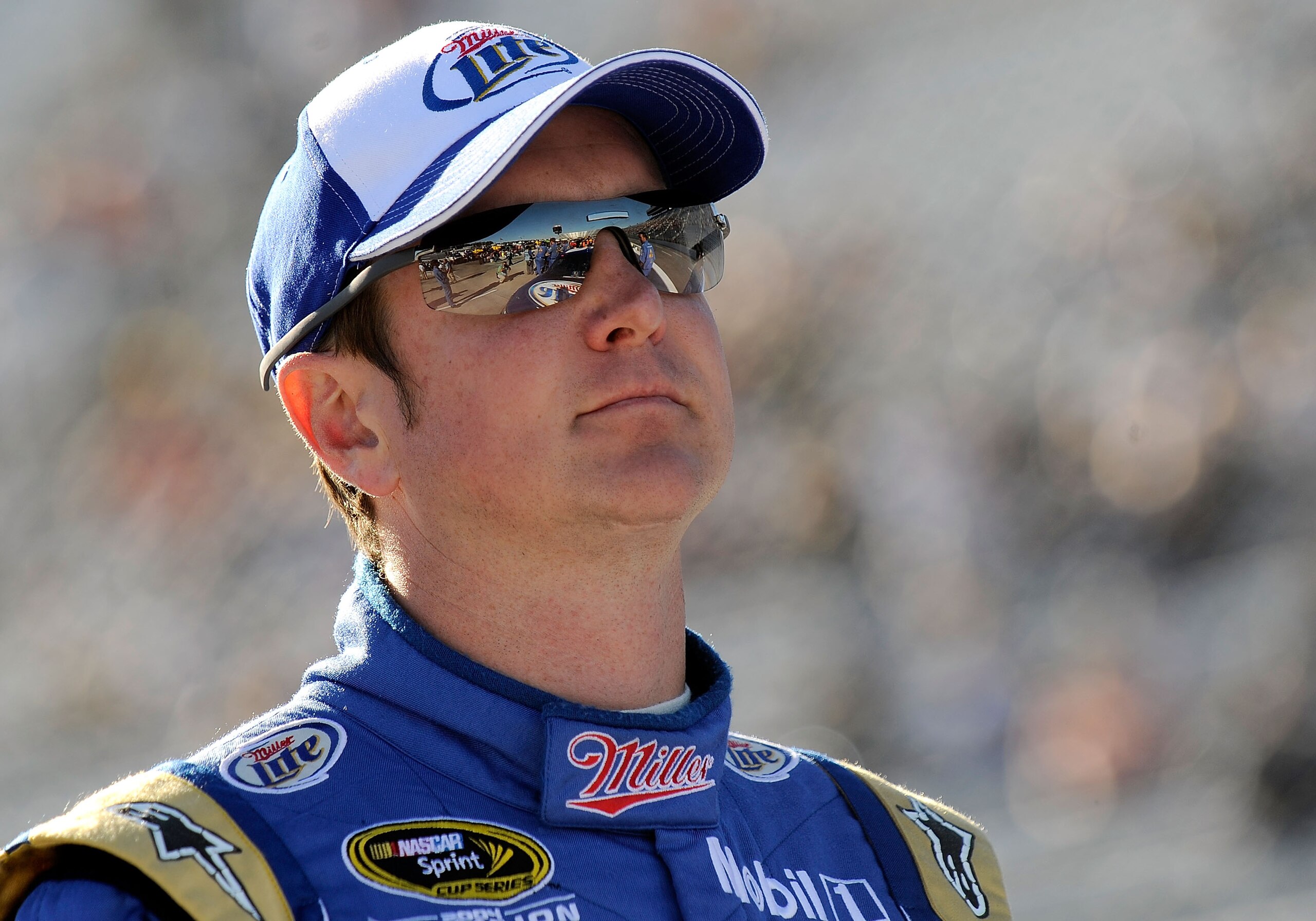 MARTINSVILLE, VA - OCTOBER 22:  Kurt Busch, driver of the #2 Operation Home Front/Miller Lite Dodge, stands next to his car on pit road during qualifying for the NASCAR Sprint Cup Series TUMS Fast Relief 500 at Martinsville Speedway on October 22, 2010 in