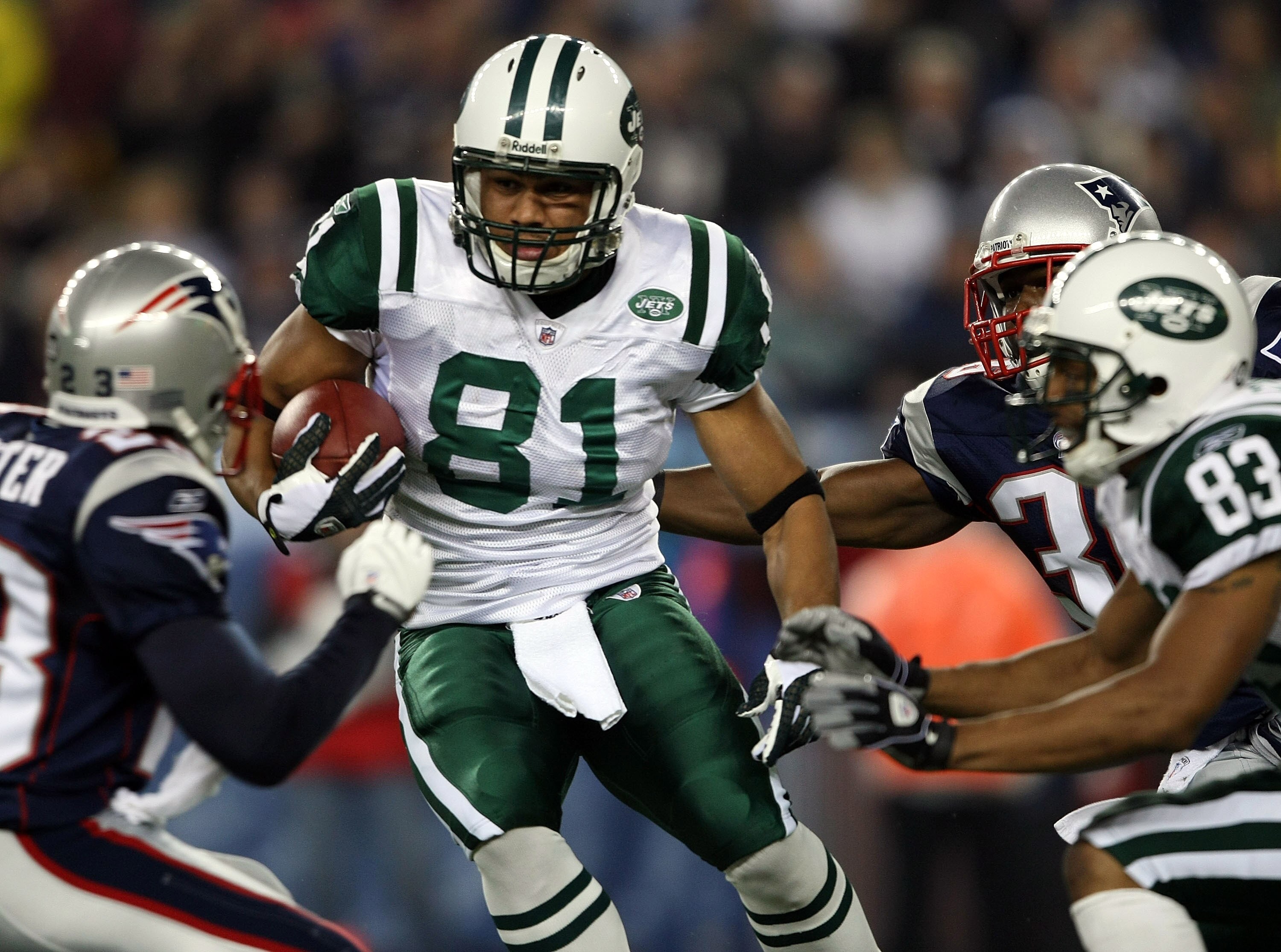 FOXBORO, MA - NOVEMBER 13:  Dustin Keller #81 of the New York Jets weaves past Jason Webster #23 of the New England Patriots on November 13, 2008 at Gillette Stadium in Foxboro, Massachusetts.  (Photo by Elsa/Getty Images)
