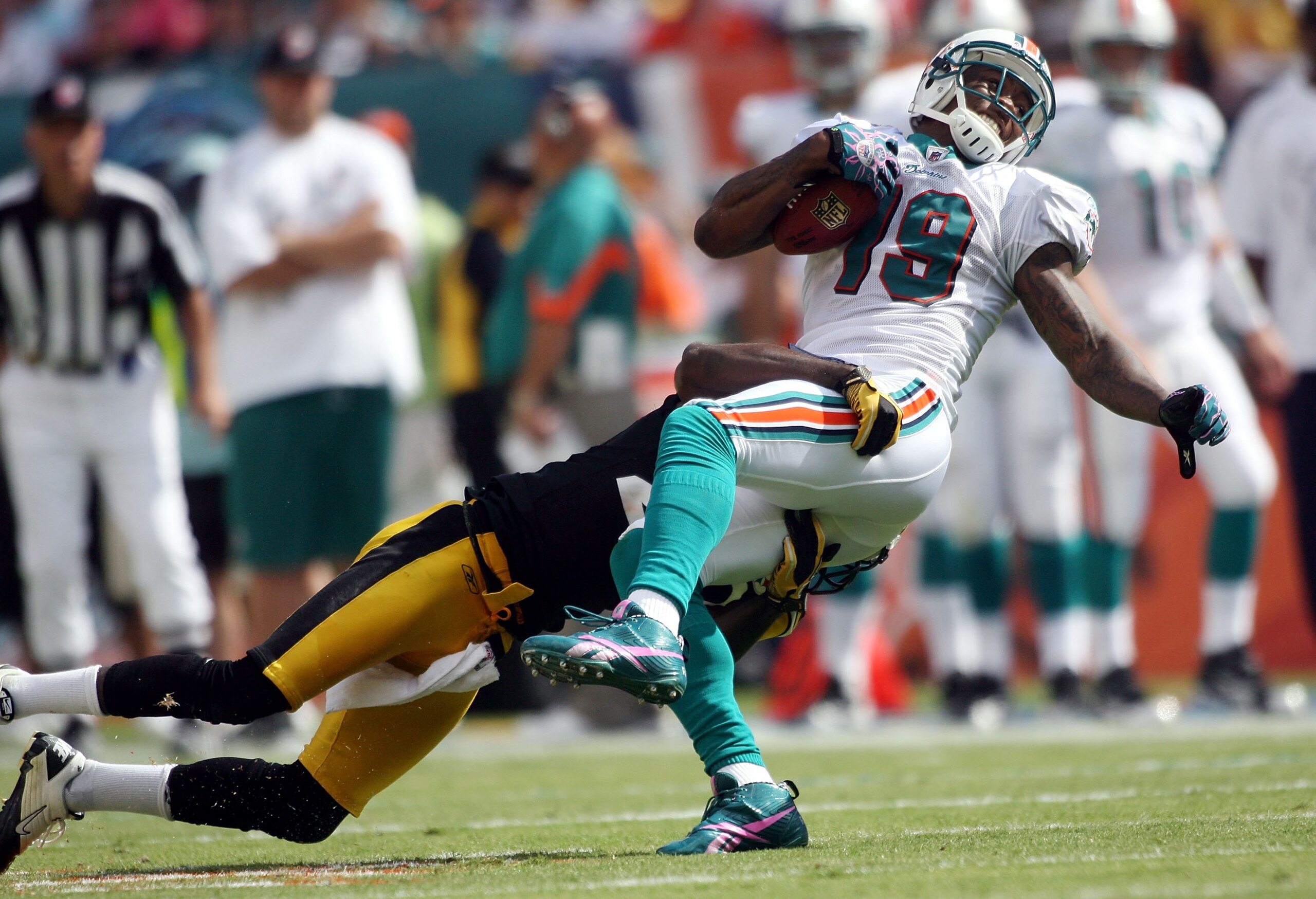 MIAMI - OCTOBER 24: Receiver Brandon Marshall #19 is brought down by the Pittsburgh Steelers at Sun Life Stadium on October 24, 2010 in Miami, Florida. (Photo by Marc Serota/Getty Images) MIAMI - OCTOBER 24: Receiver Brandon Marshall #19 is brought down by the Pittsburgh Steelers at Sun Life Stadium on October 24, 2010 in Miami, Florida. (Photo by Marc Serota/Getty Images)