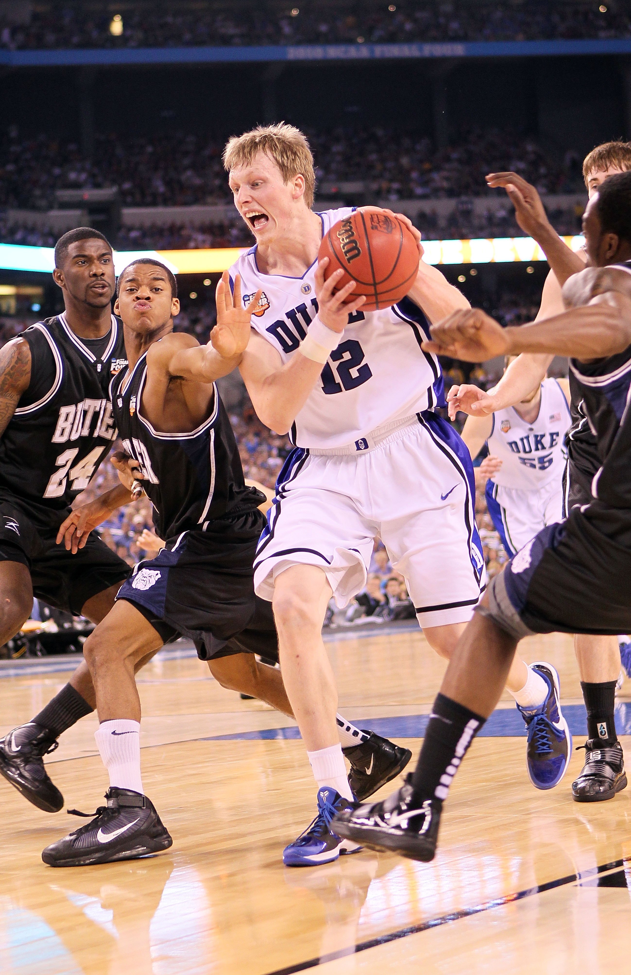 INDIANAPOLIS - APRIL 05:  Kyle Singler #12 of the Duke Blue Devils drives against the Butler Bulldogs during the 2010 NCAA Division I Men's Basketball National Championship game at Lucas Oil Stadium on April 5, 2010 in Indianapolis, Indiana.  (Photo by An